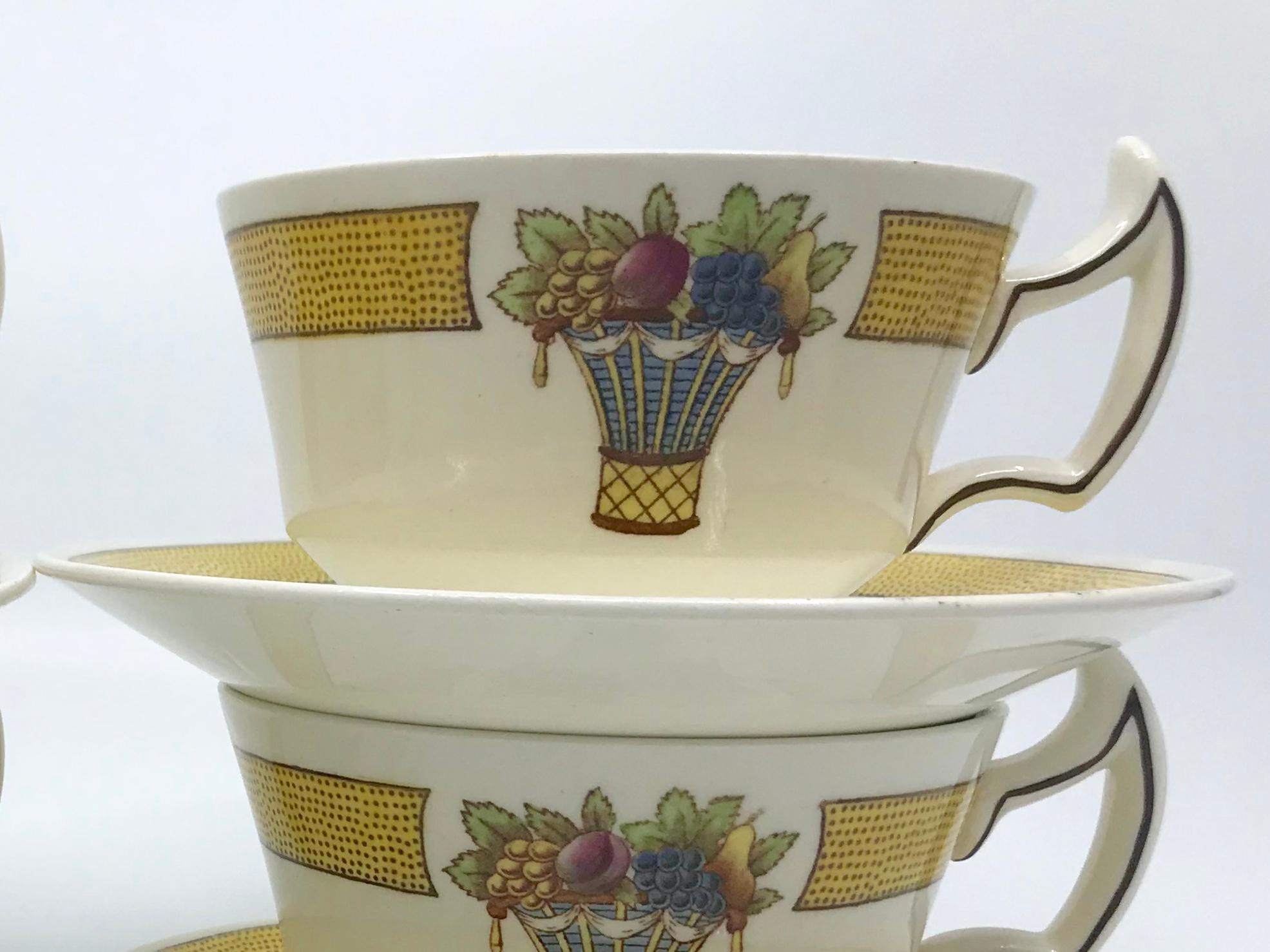 Set of four Wedgwood Directoire pattern yellow banded cream cups and saucers. Cups and saucers in the Directoire pattern and style with characteristic handles of the post Revolutionary six year period of the French Directory. England, circa