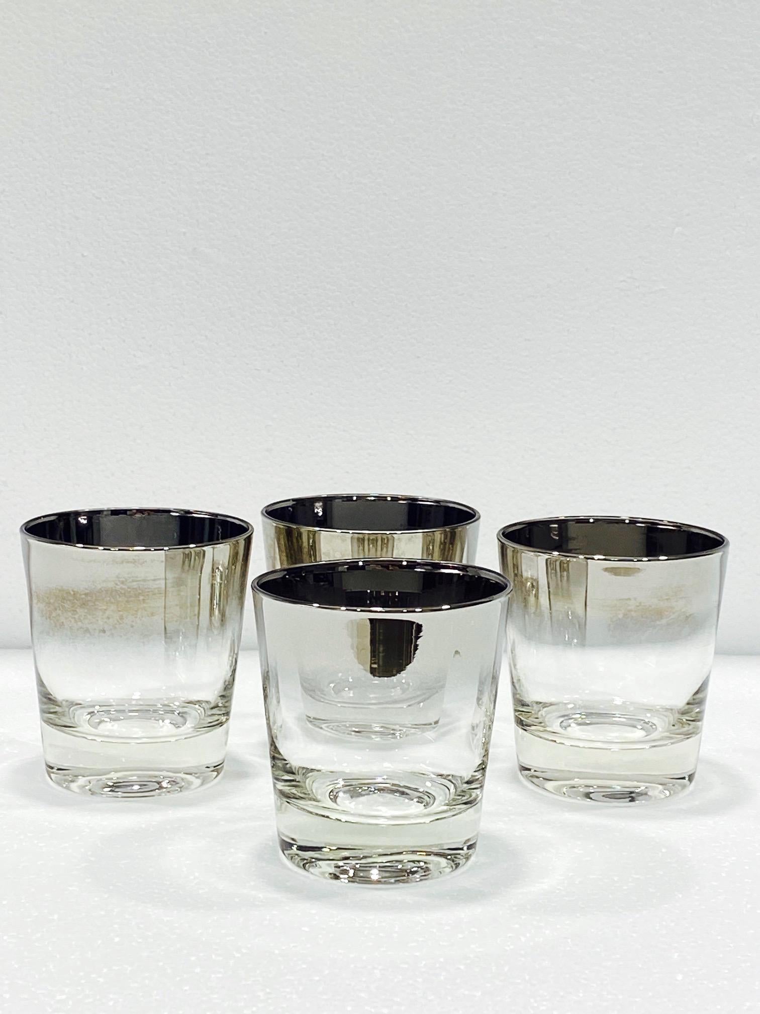 Iconic Mid-Century Modern barware glasses with silver fade overlay design. Great looking rock glasses with tapered forms and gradient rims with in ombre gunmetal. Makes a smart and handsome addition to any barware collection. 
    
    