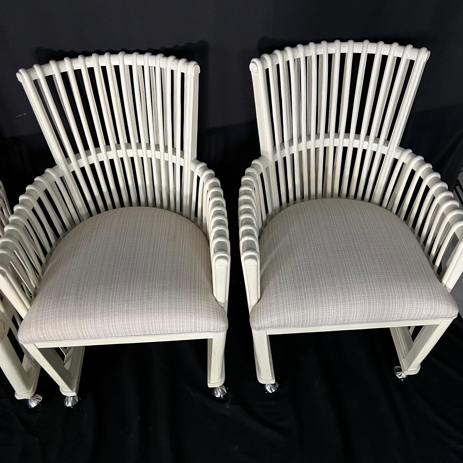 Indonesian Set of Four White Bent Rattan Dining or Club Chairs with Casters