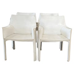 Juego de cuatro sillones cabina de cuero blanco by Cassina