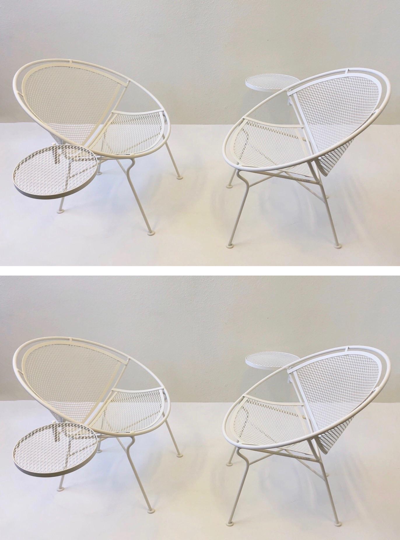A set of four ‘Radar’ patio chairs with a occasional side table designed by Salterini in the 1950s. The chairs are constructed of steel that has been newly powder coated satin white. The occasional table can be removed if desired. We also have an
