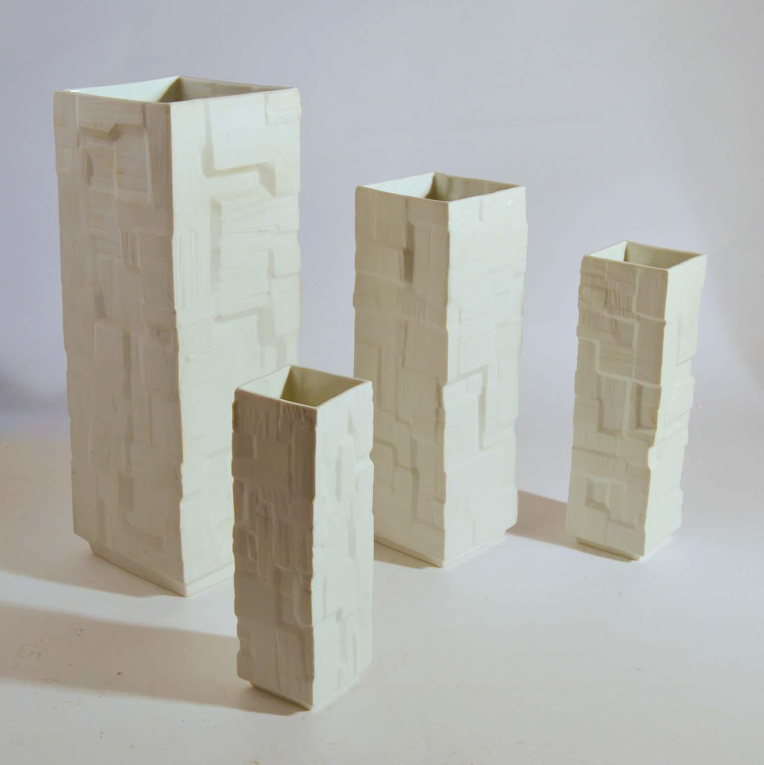 Cast Group of Four Large White Square Relief Vases For Sale