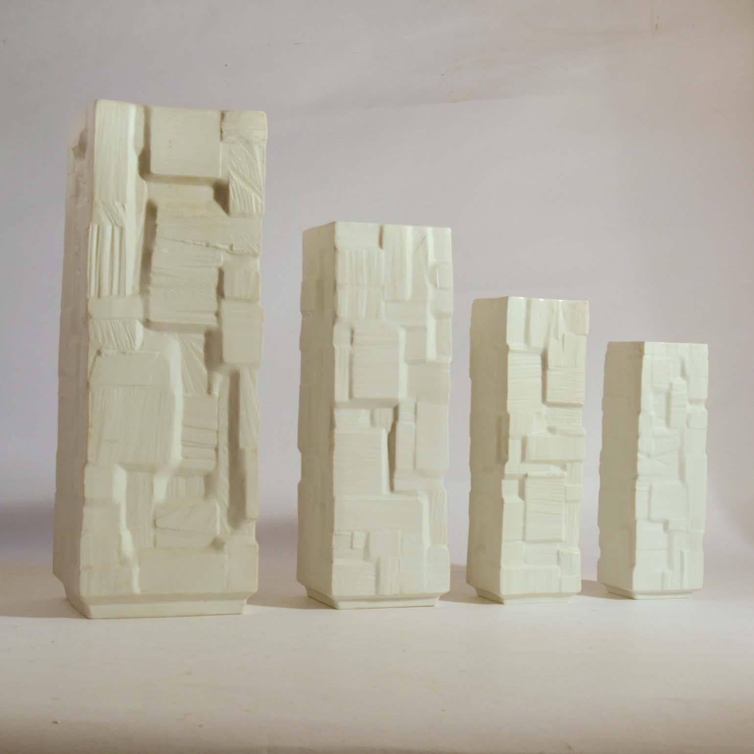 Mid-20th Century Group of Four Large White Square Relief Vases For Sale
