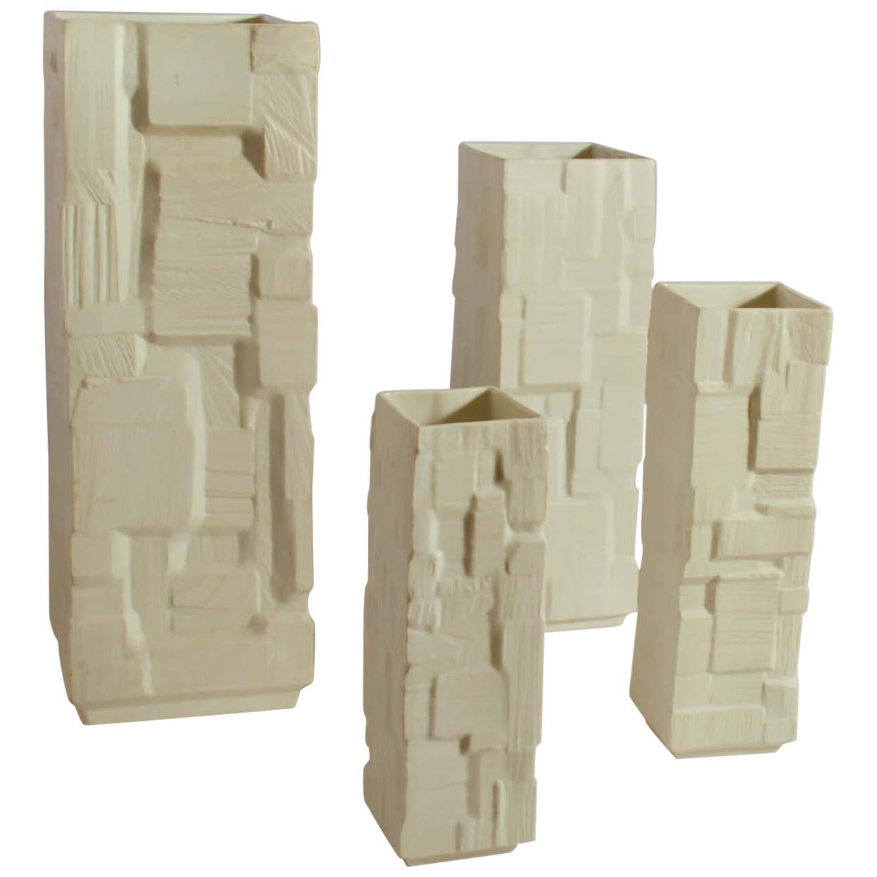 Group of Four Large White Square Relief Vases