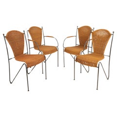 Ensemble de quatre chaises en osier et fer par Frederic Weinberg 1950s