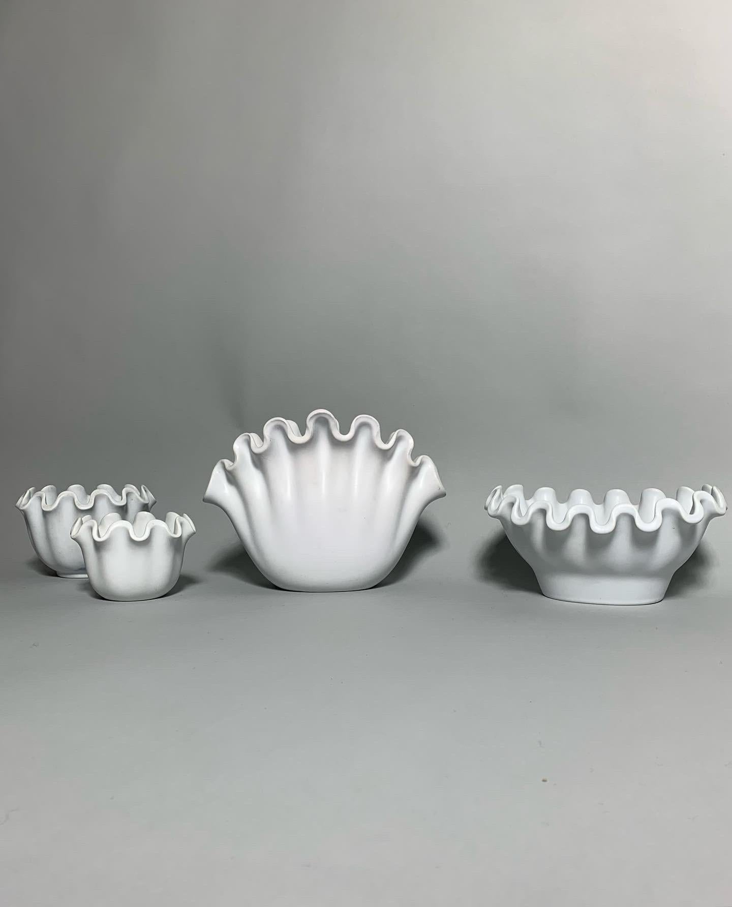 Rare set of Wilhelm Ka°ge ‚Va°ga’ (wave) bowls for the renowned Swedish ceramic manufacturer Gustavsberg in the 1950s.

Hand-crafted of white glazed stoneware. All pieces marked on bottom.

From left to right. Listed price is for the whole