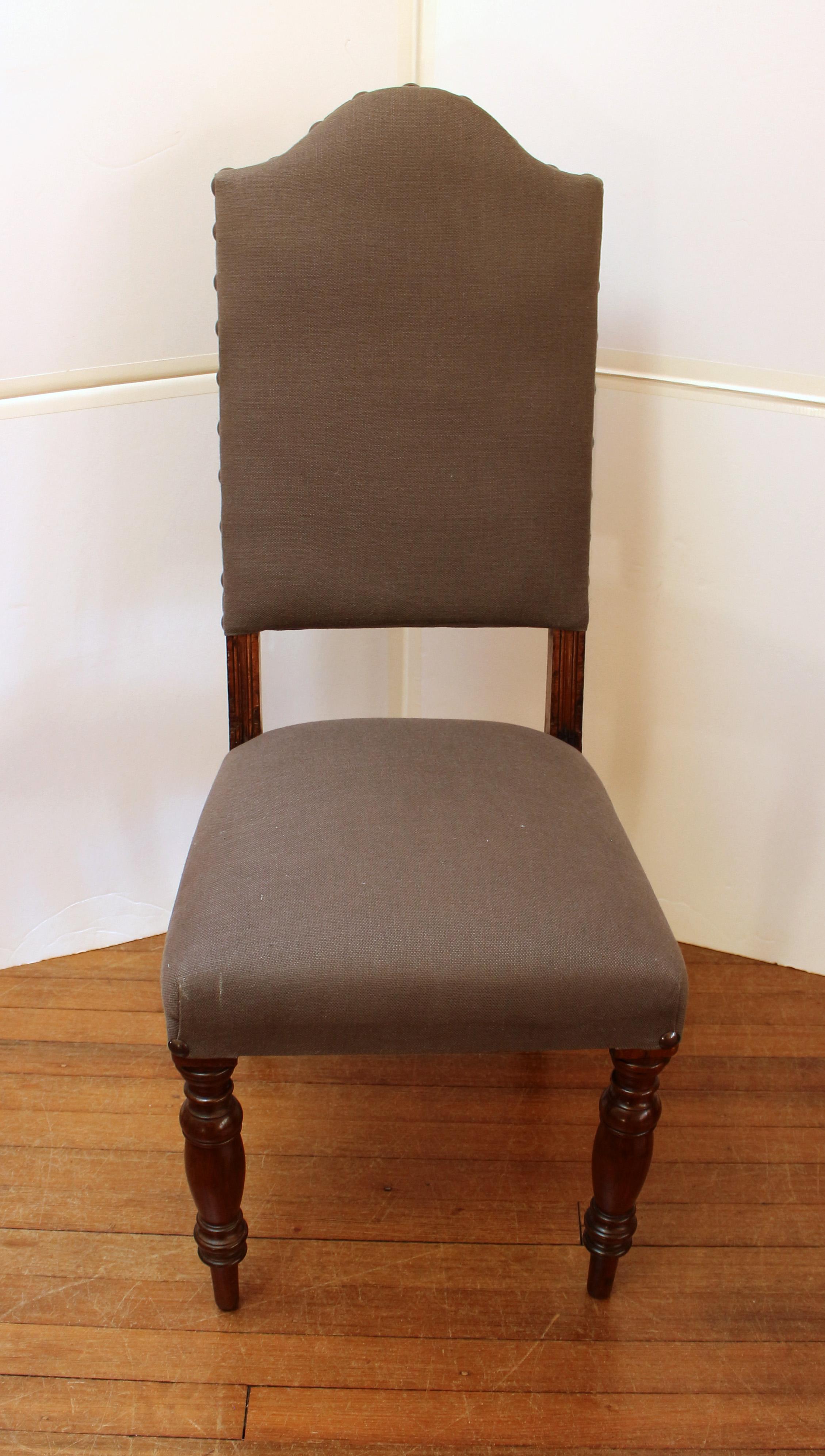 William IV, circa 1830-40s, set of 4 dining or side chairs, English. Shaped high upholstered backs. Robustly turned front legs, splayed back legs, mahogany. Attractively upholstered with large studs accenting the backs. 43 1/4