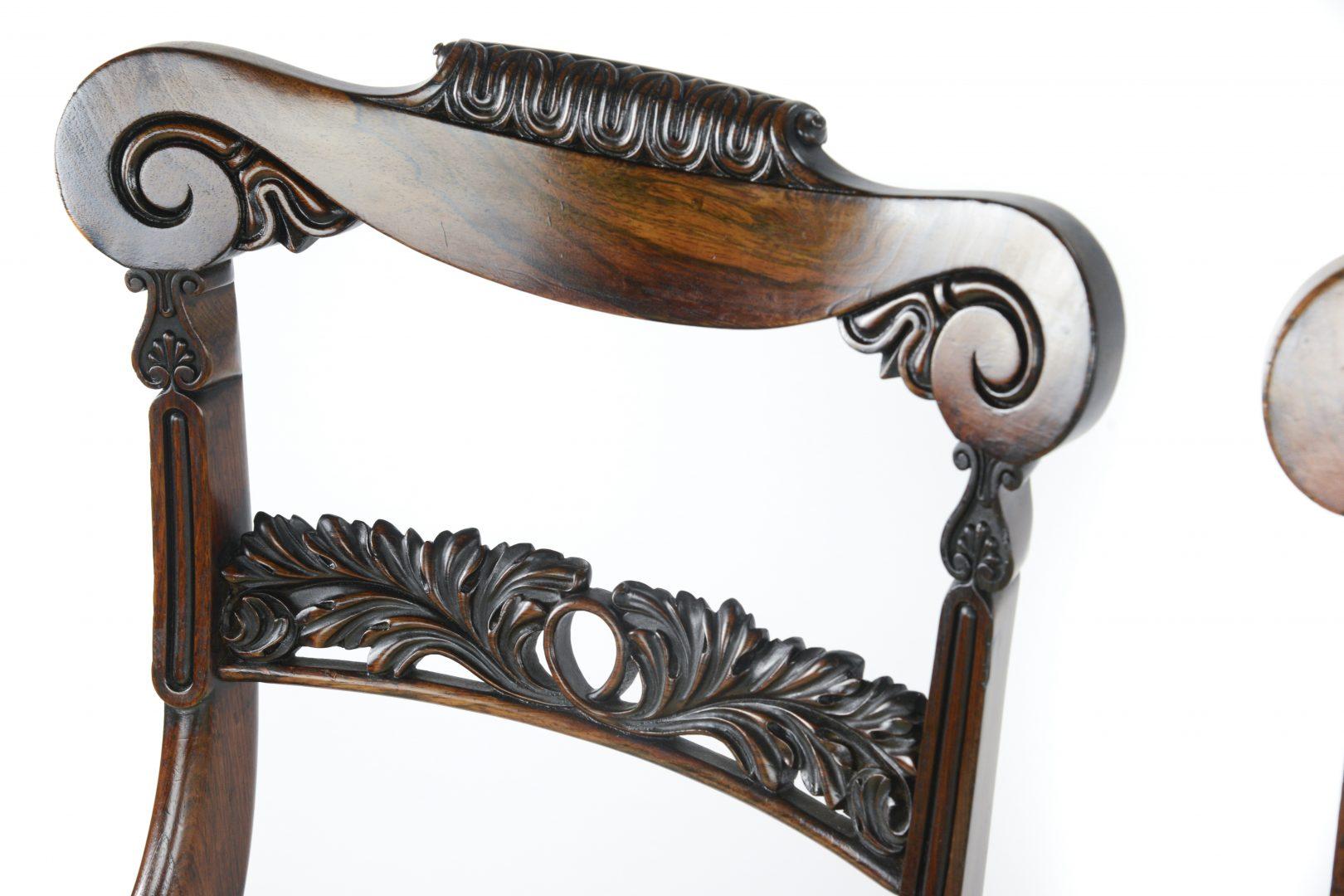 Set of four William IV rosewood Library chairs attributed to Gillows, they have scrolling top rails with foliate carved and pierced back rests, drop-in seats and reeded front legs.


Gillows of Lancaster and London, also known as Gillow & Co.,