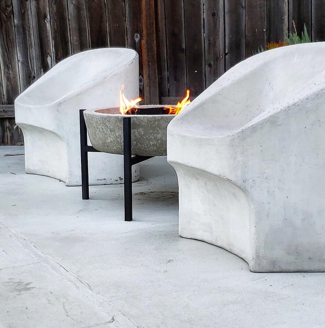 Rare set of sculptural concrete chairs by Willy Guhl for Eternit. 4 matching chairs available. Great patina. Sold as a set of 4.

Pair available for $14,500.