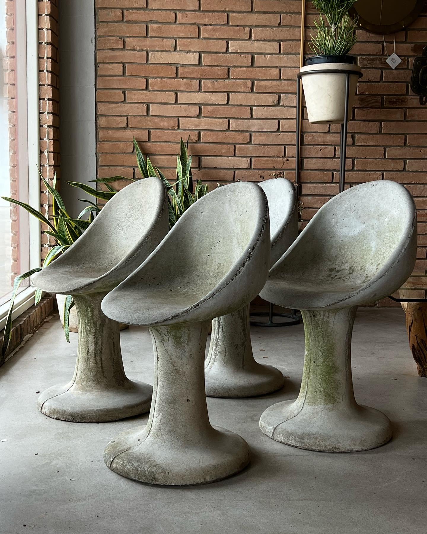 Unique set of concrete aggregate tulip chairs in the Extremely well made and heavy. These examples have a beautiful environmental patina and would be a lovely addition to any garden or patio. 

Would work in any mid-century, Contemporary,
