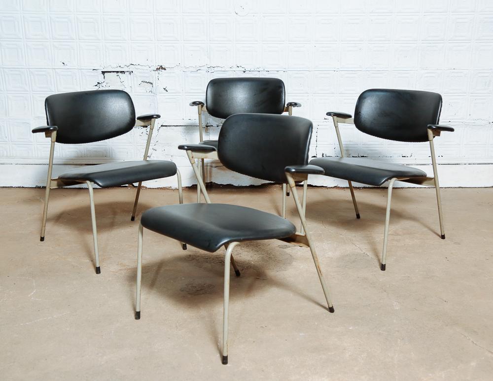 Set of 4 low side chairs by Willy van der Meeren.

Black vinyl upholstery on gray metal frame. Stackable.

Made by Tubax, Belgium.