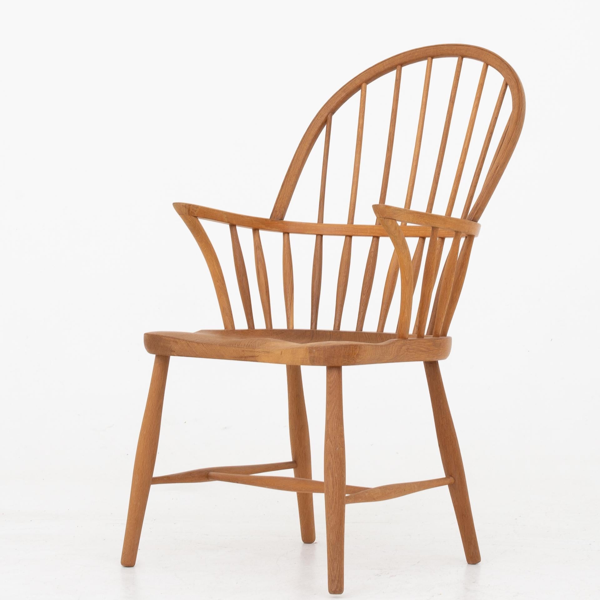 Set of four 'Windsor' chairs in oak. Model CH 18A. Maker Carl Hansen.