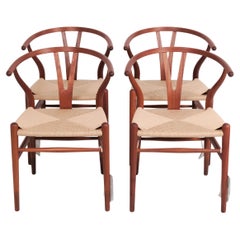 Set Of Four Wishbone Chairs Model CH24 In Mahogany 
Wicker By Hans J. Wegner