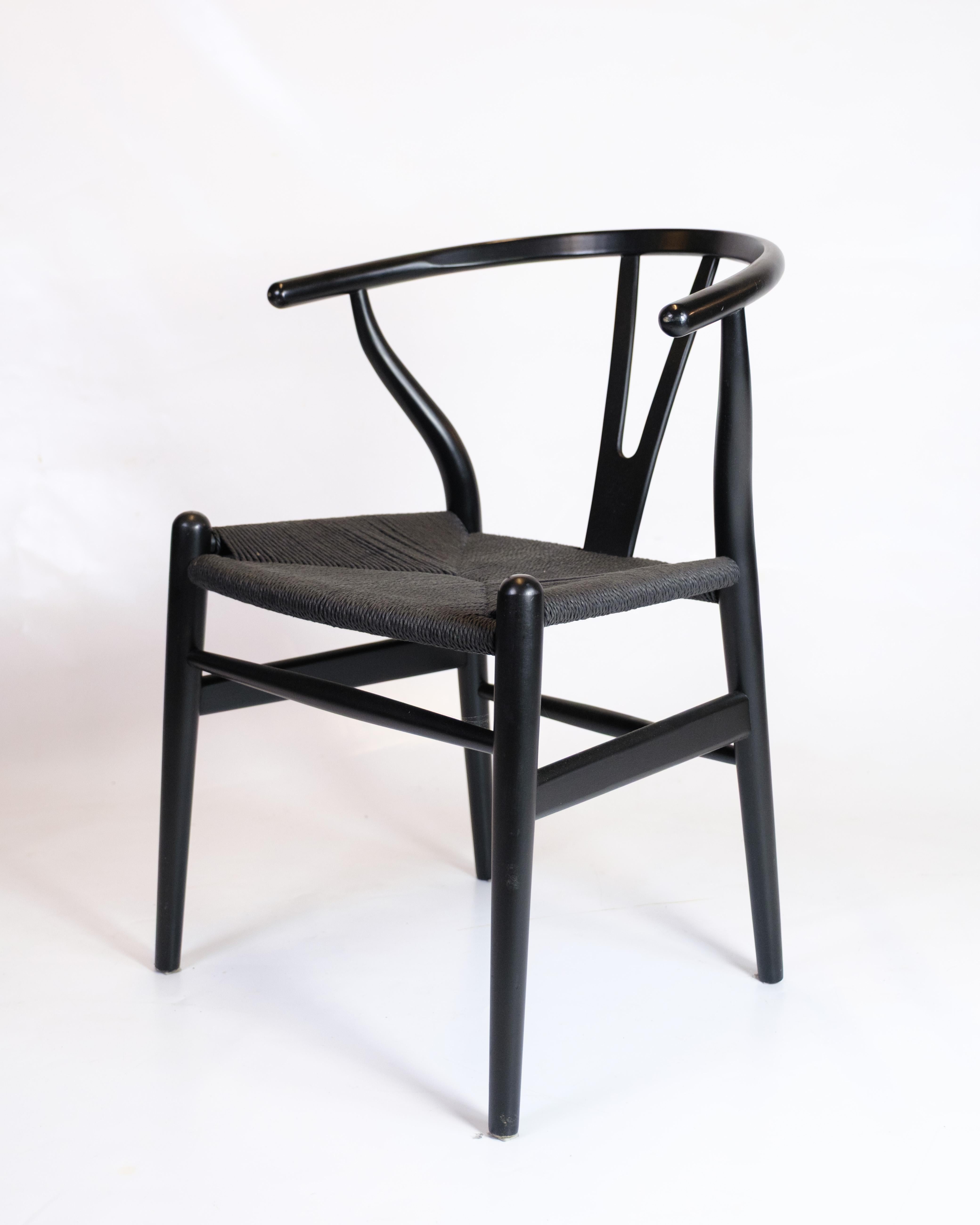 Danese Set di quattro sedie Wishbone modello CH24 in nero di Hans J. Wegner in vendita