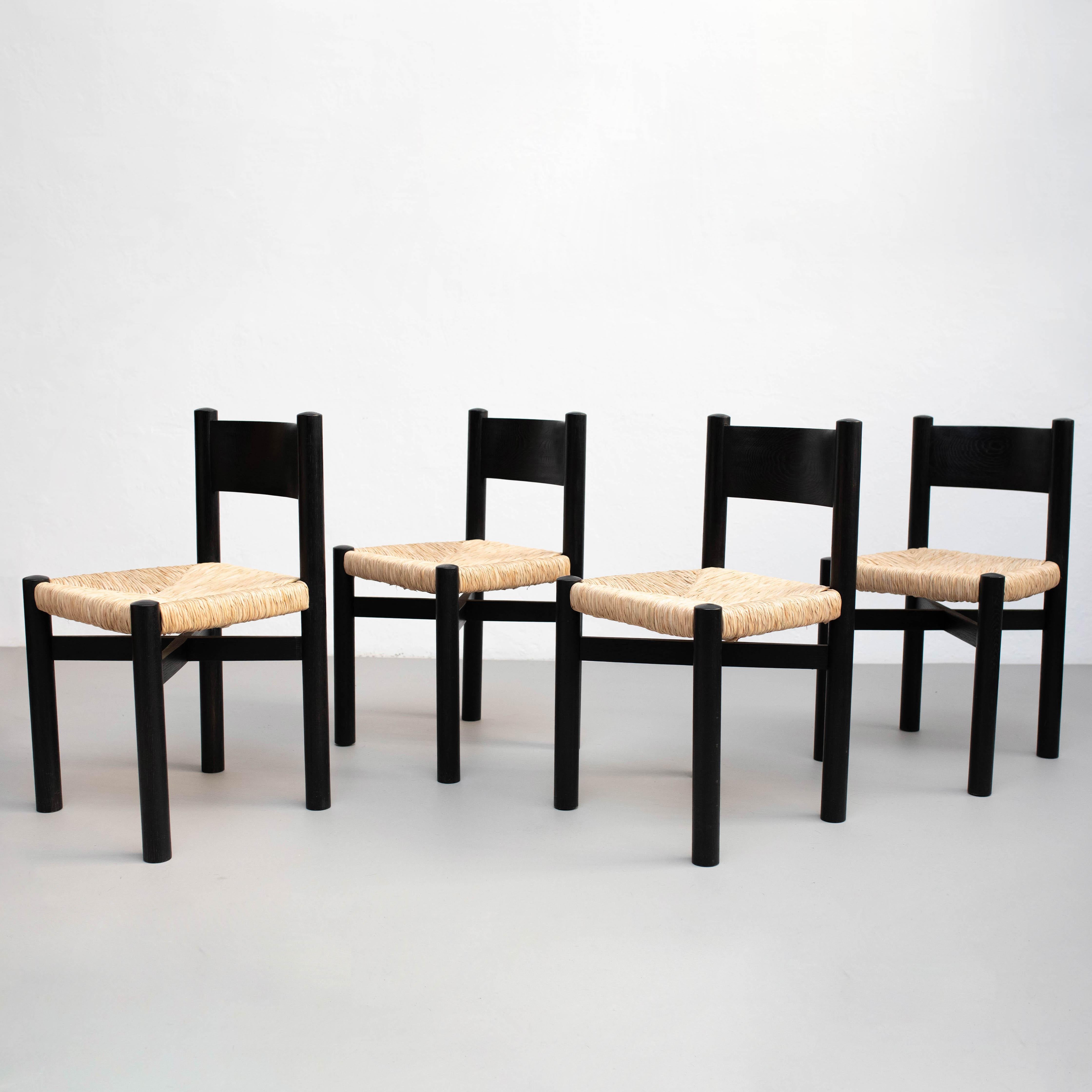 Mid-Century Modern Set of Four Wood and Rattan Chairs after Charlotte Perriand, circa 1980 For Sale