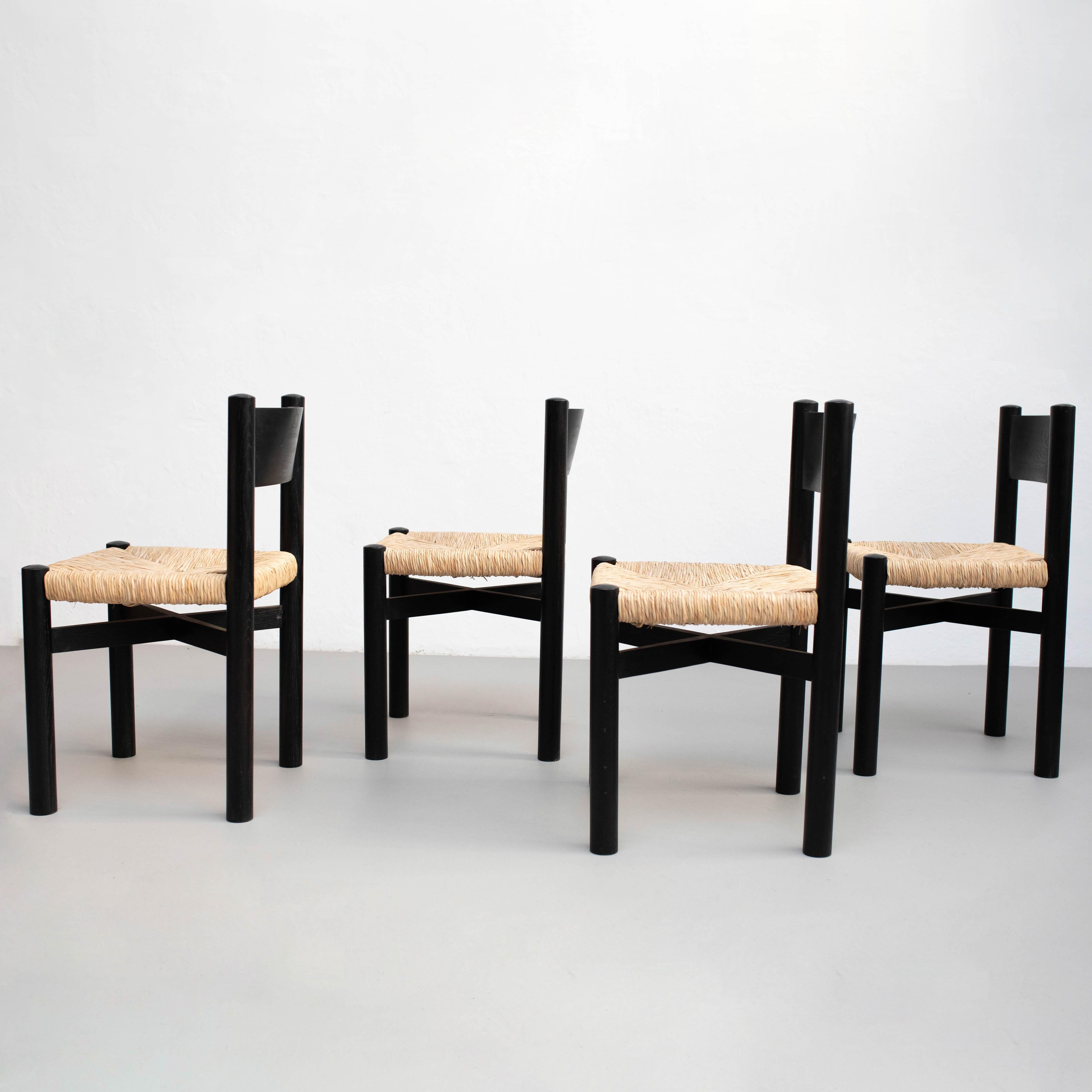 Italian Set of Four Wood and Rattan Chairs after Charlotte Perriand, circa 1980 For Sale