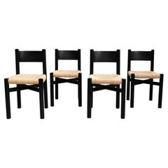 Ensemble de quatre chaises en bois et rotin d'après Charlotte Perriand - Circa 1980