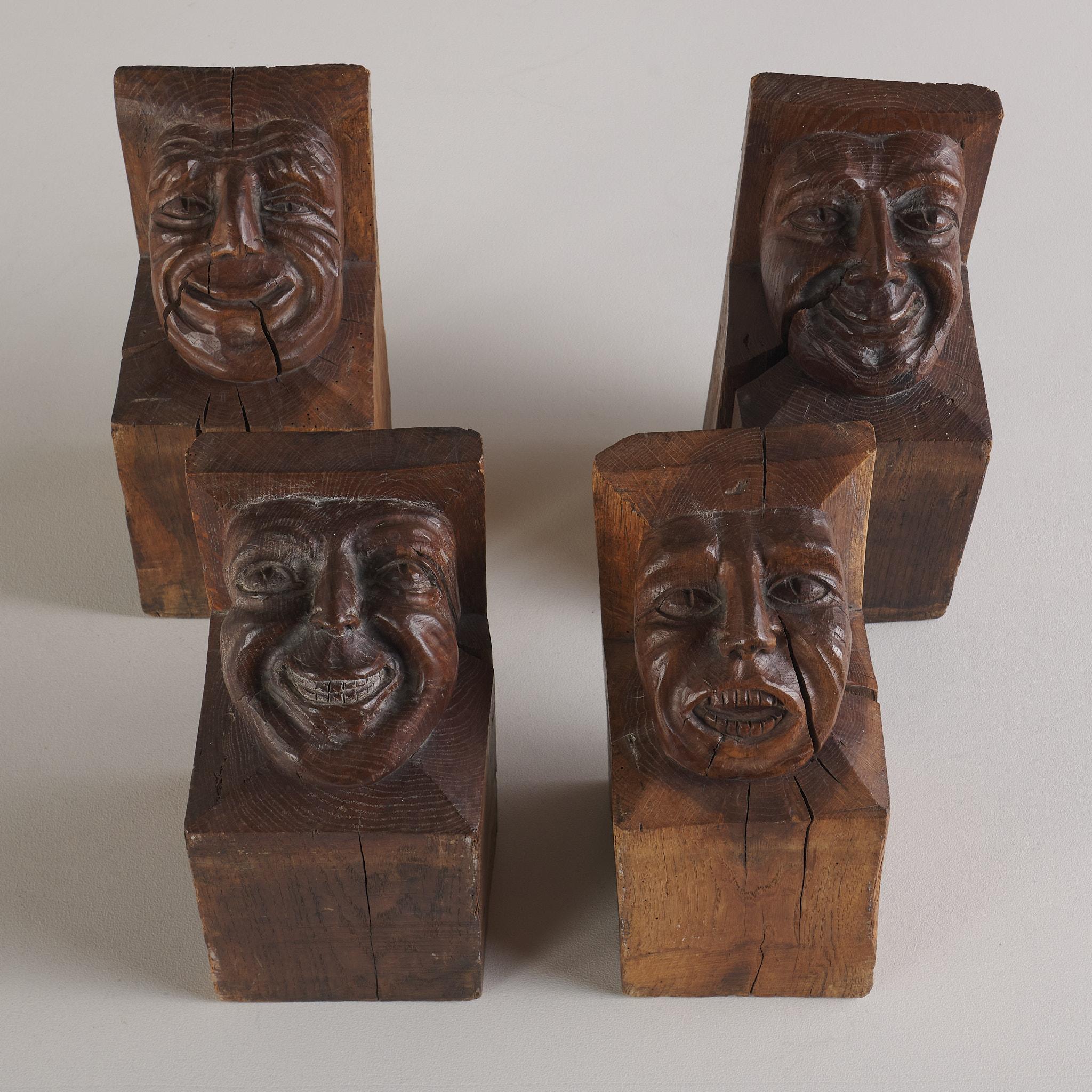 A striking set of four hand-carved wooden corbels, each showcasing unique carvings and exceptional craftsmanship. Perfect as decorative brackets, architectural accents or displayed together as sculptural wall art.