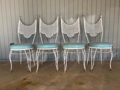 Set of four wrought iron mid century modern vintage patio chairs