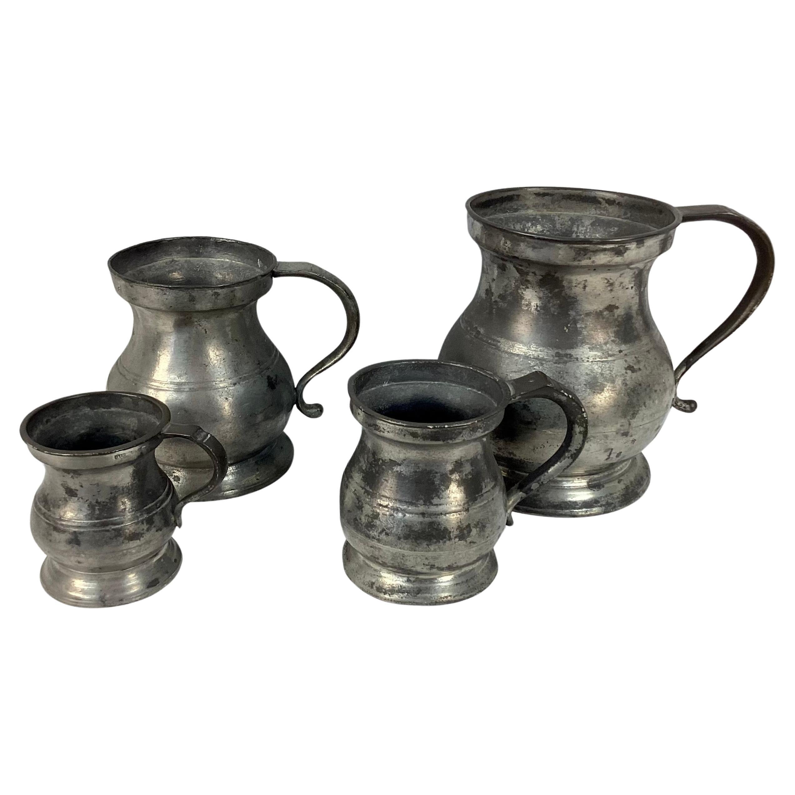 Late Victorian Set Of Four Yates & Birch English Pewter Graduated Pitchers For Sale
