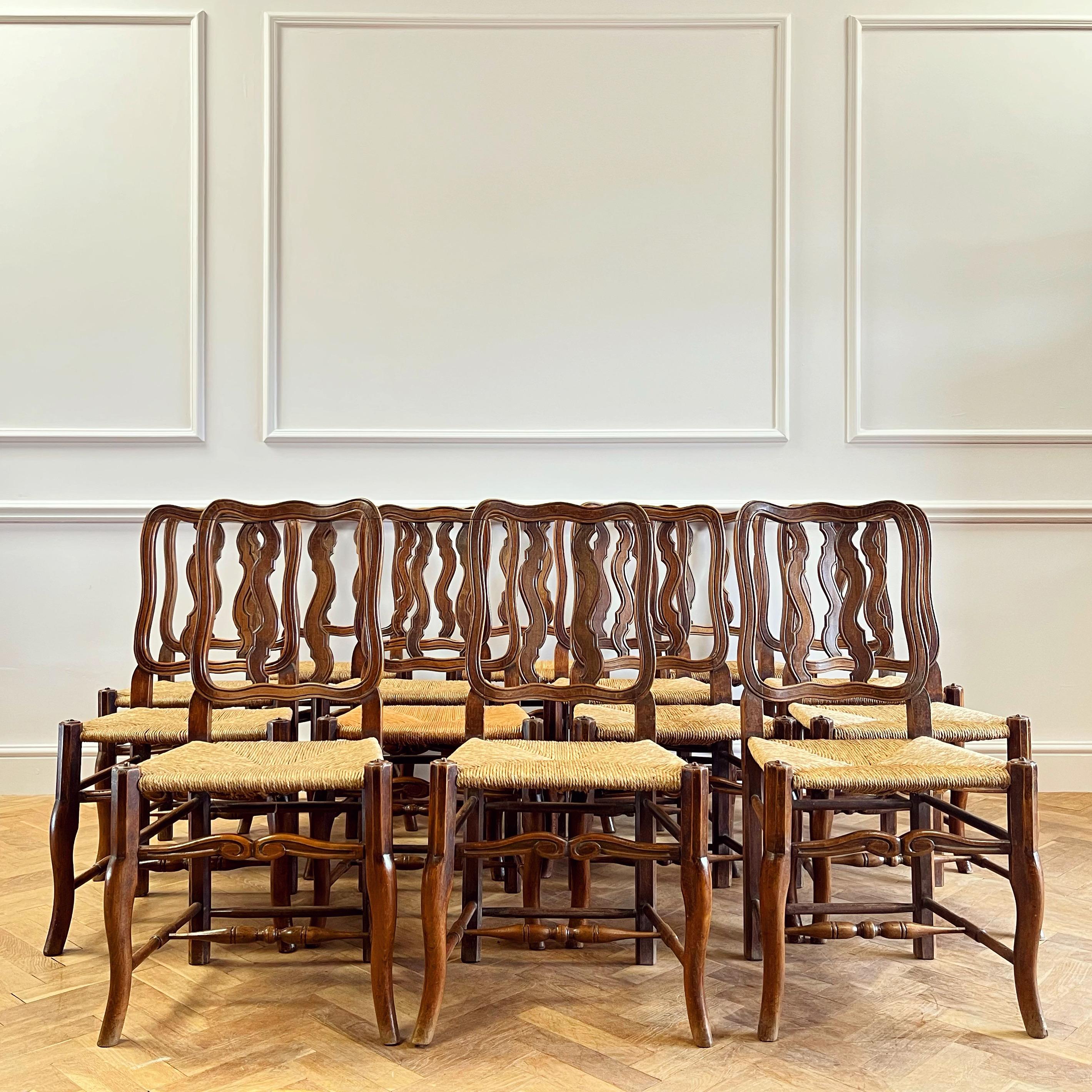 Set of Fourteen Early Twentieth Century French Vernacular Dining Chairs In Good Condition For Sale In London, GB