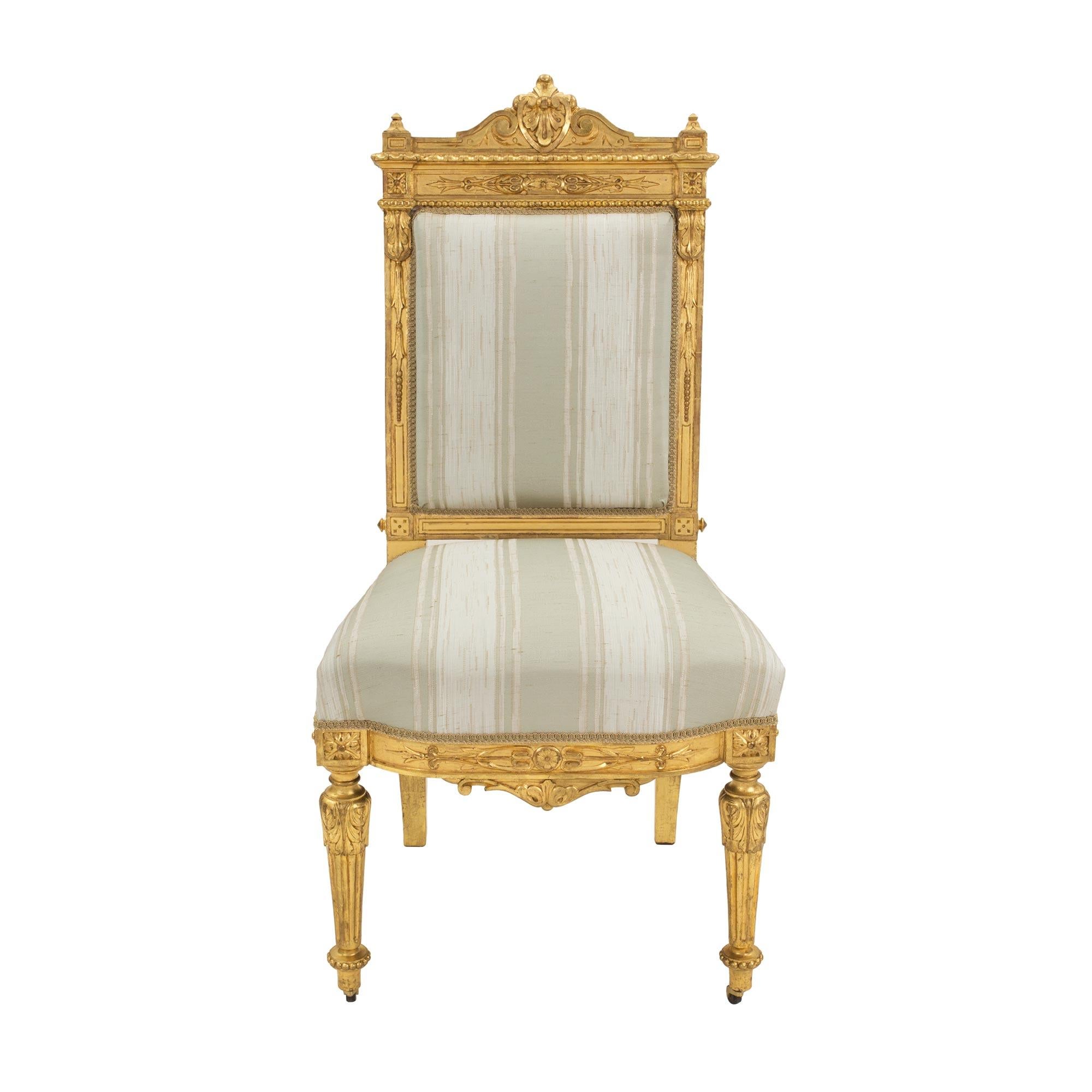 Set of Fourteen French 19th Century Louis XVI St. Giltwood Dining Chairs For Sale 2