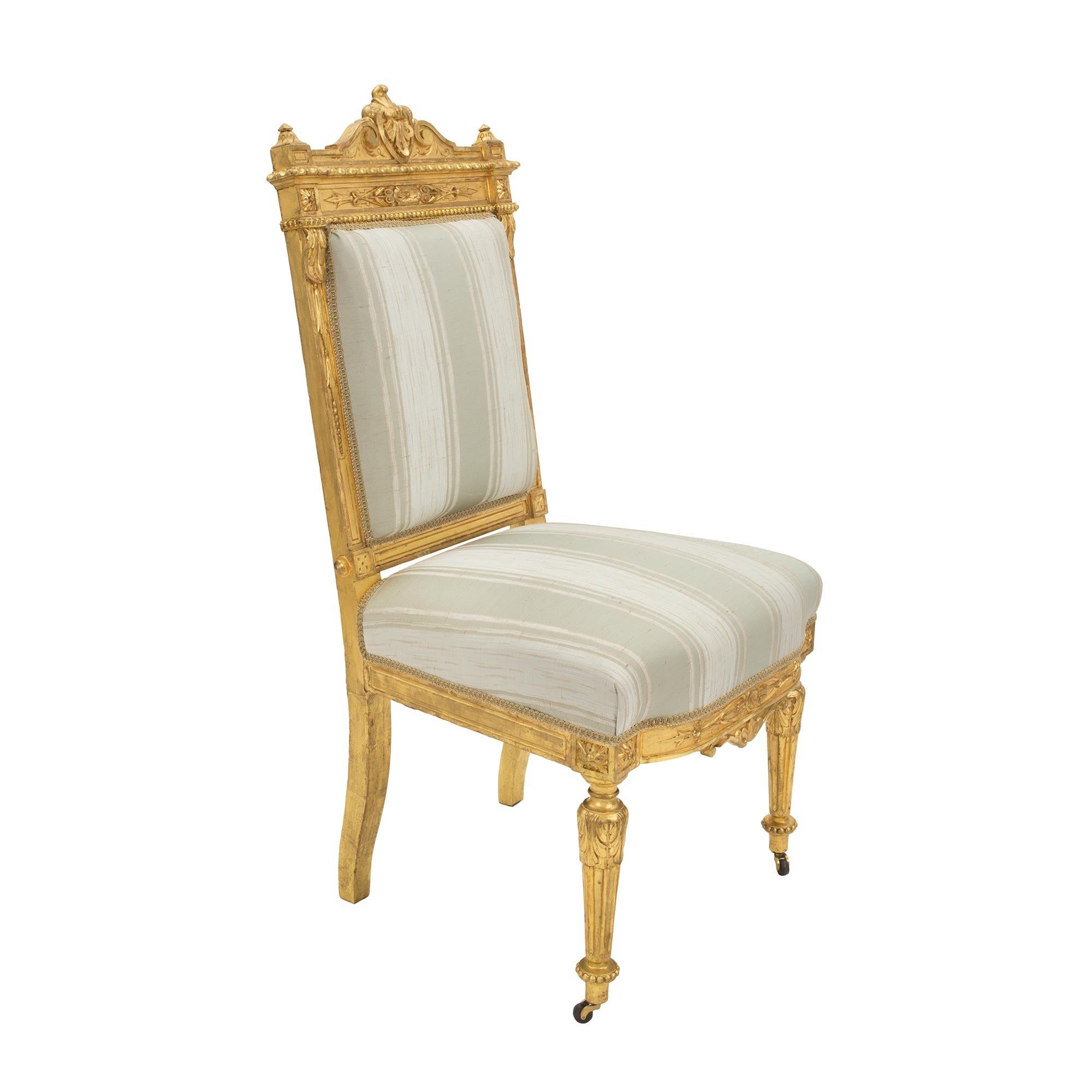 Set of Fourteen French 19th Century Louis XVI St. Giltwood Dining Chairs For Sale 3