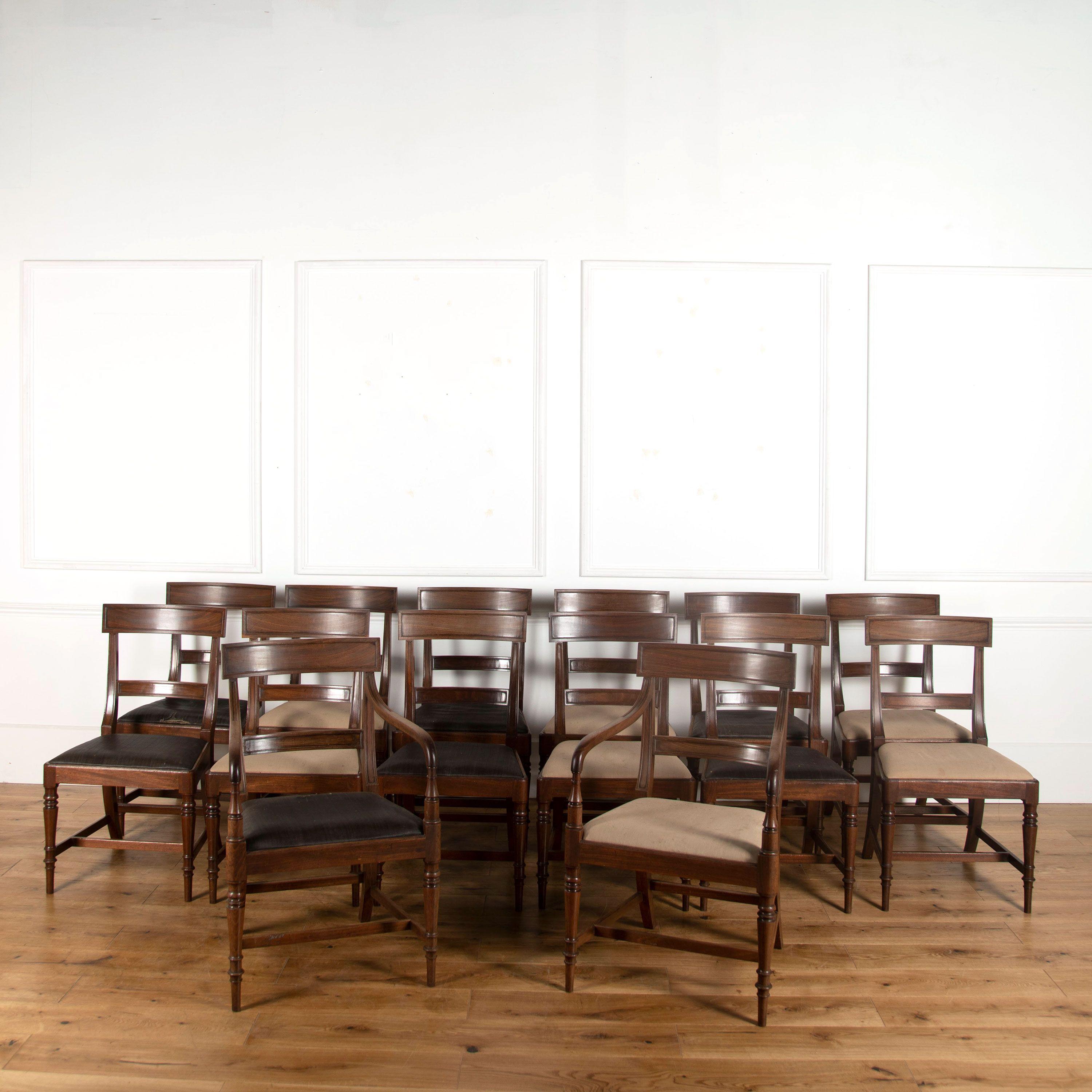 A set of 12 single & 2 carver Regency mahogany dining chairs, made from the finest timber ( probably entering the country via Whitehaven) known as Whitehaven Timber and used by firms in the north of England, Gillows of Lancaster being a strong