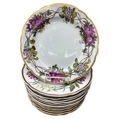Ensemble de quatorze assiettes à fleurs Spode