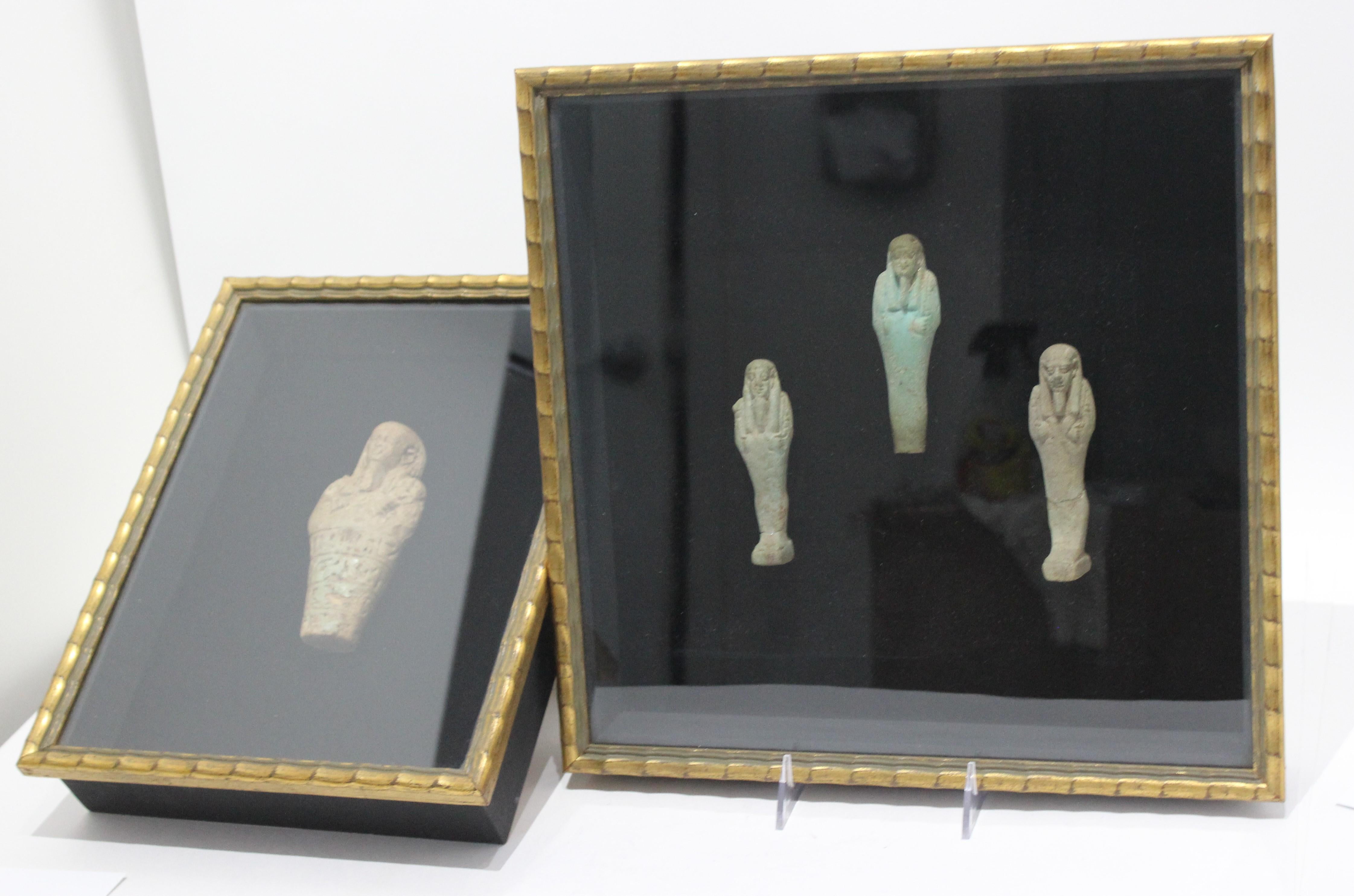 This stylish two-piece set of framed Egyptian Ushabti figures were acquired from a Palm Beach estate. And it would seem that the face on each piece are all the same man as was customary, so the gods of underworld would recognize and protect that