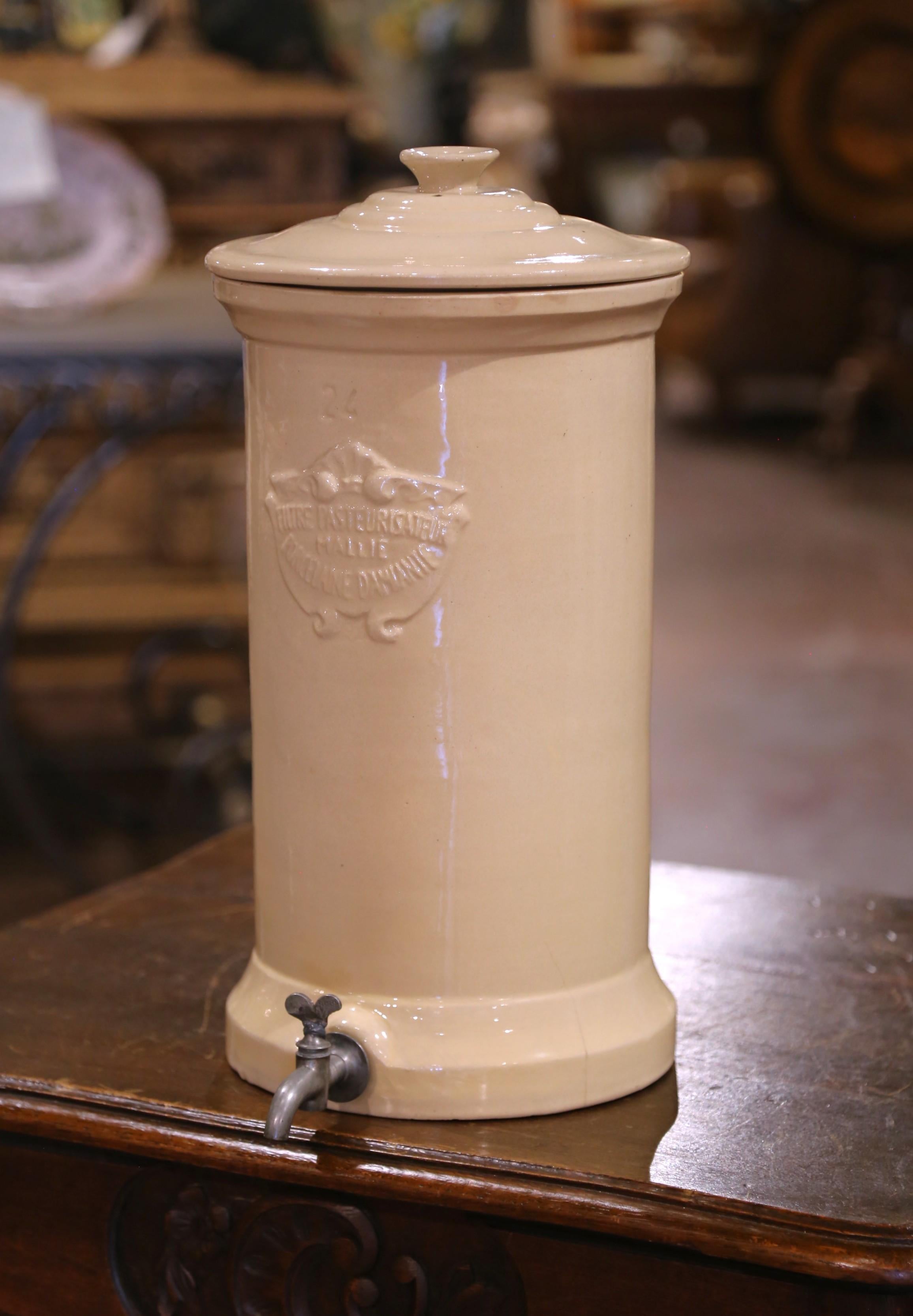 This set of antique ceramic water filters was crafted in Provence, France, circa 1870. Originally designed as promotional display pieces for a French pharmacy, each vessel advertises the innovative “Filtre Pasteurisateur Mallié Porcelaine Damiante,”