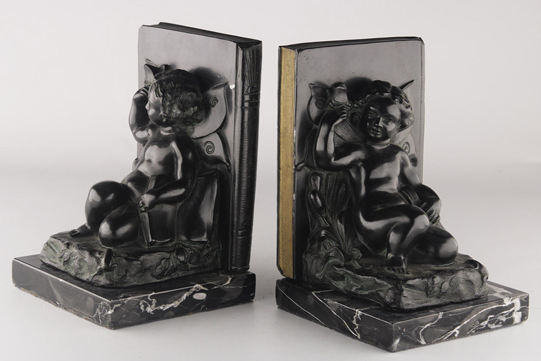 Set of early 20th century french Art Déco zamac winged cherub/fairy child bookends with marble base

By: unknown
Material: aluminum, bronze, marble, metal, zinc, copper
Technique: cast, polished, metalwork, patinated
Dimensions: 5 in x 5 in x 7