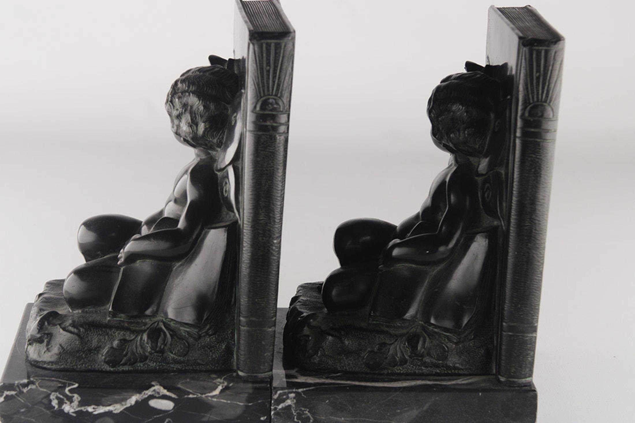 Patinated Set of French Art Déco Zamac Winged Cherub/Fairy Child Bookends with Marble Base For Sale