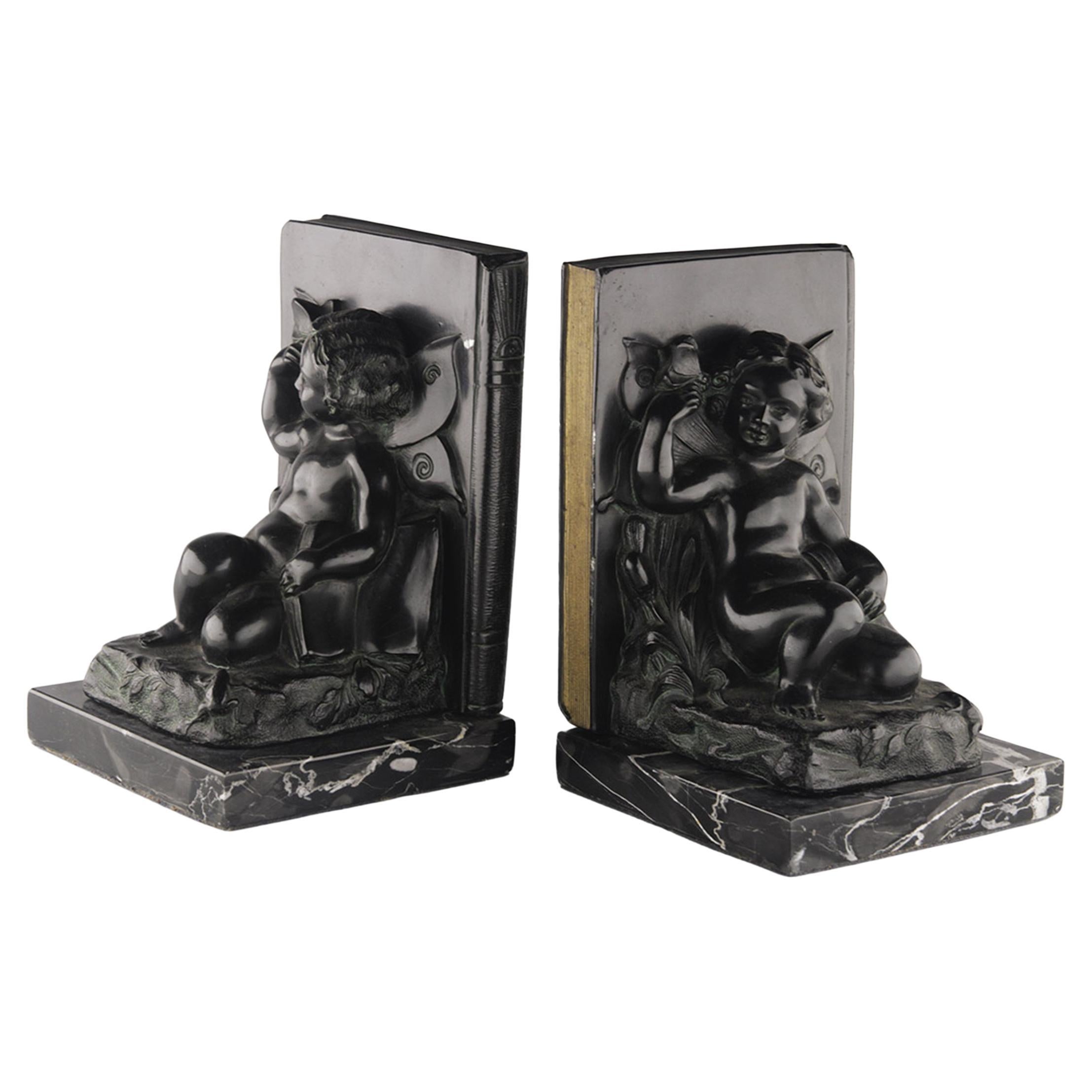 Set of French Art Déco Zamac Winged Cherub/Fairy Child Bookends with Marble Base For Sale