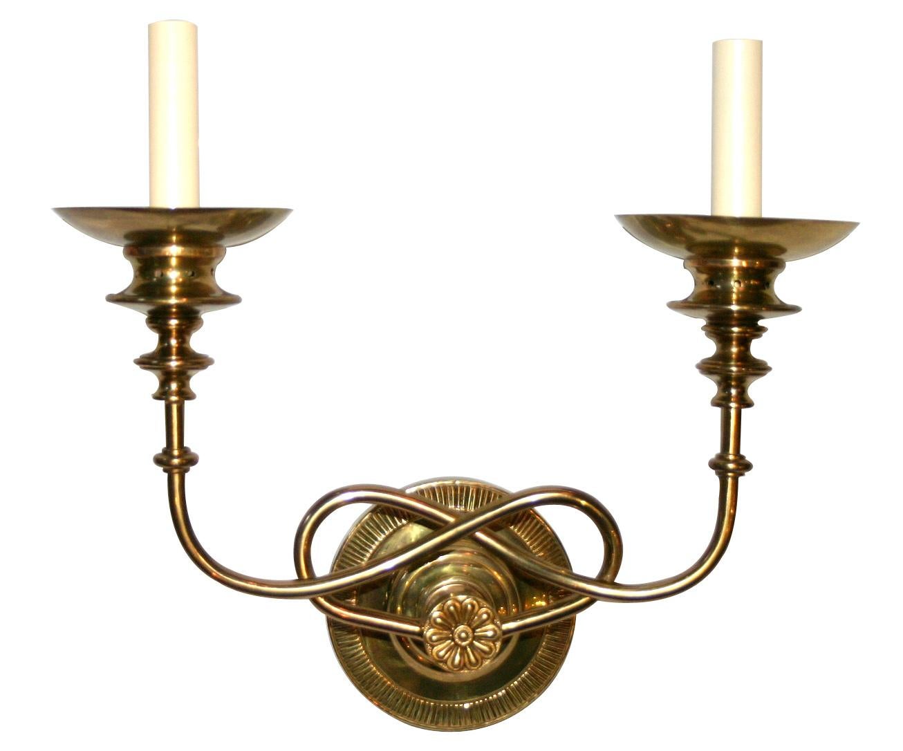 Set of four circa 1940's French gilt bronze sconces with twisted arms and original gilt finish. Sold per pair.

Measurements:
Height: 13?
Width: 14.5?
Depth: 6.25?