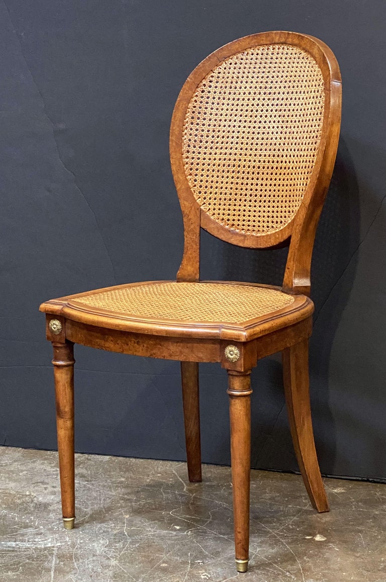 Set of French Caned Walnut Bergère Dining Chairs, Two Arms and Four