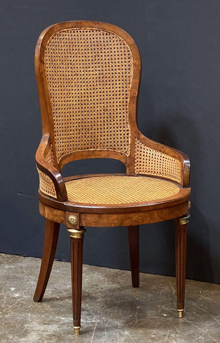 Set of French Caned Walnut Bergère Dining Chairs, Two Arms and Four