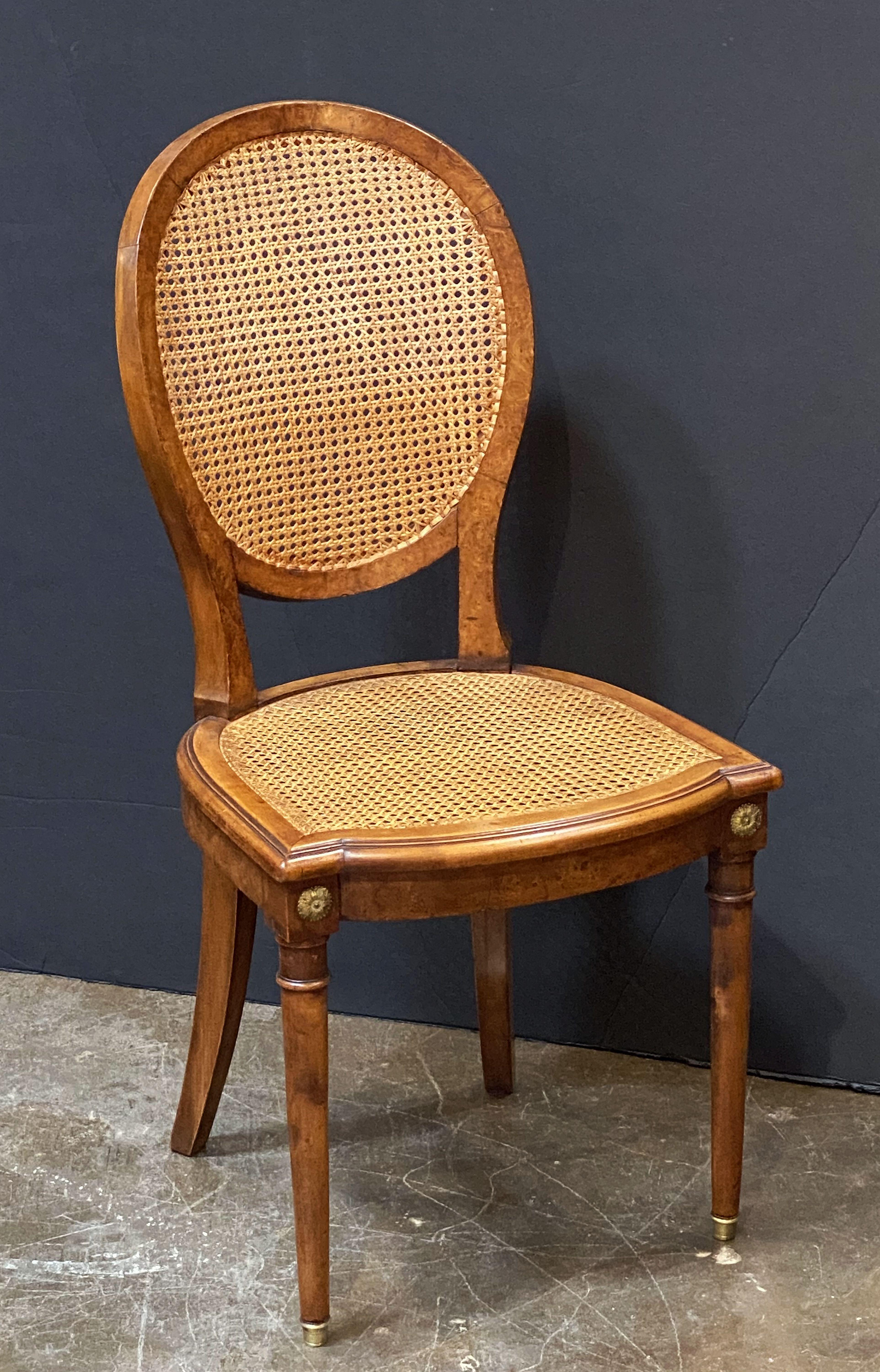 Set of French Caned Walnut Bergère Dining Chairs, Two Arms and Four Side Chairs In Good Condition In Austin, TX