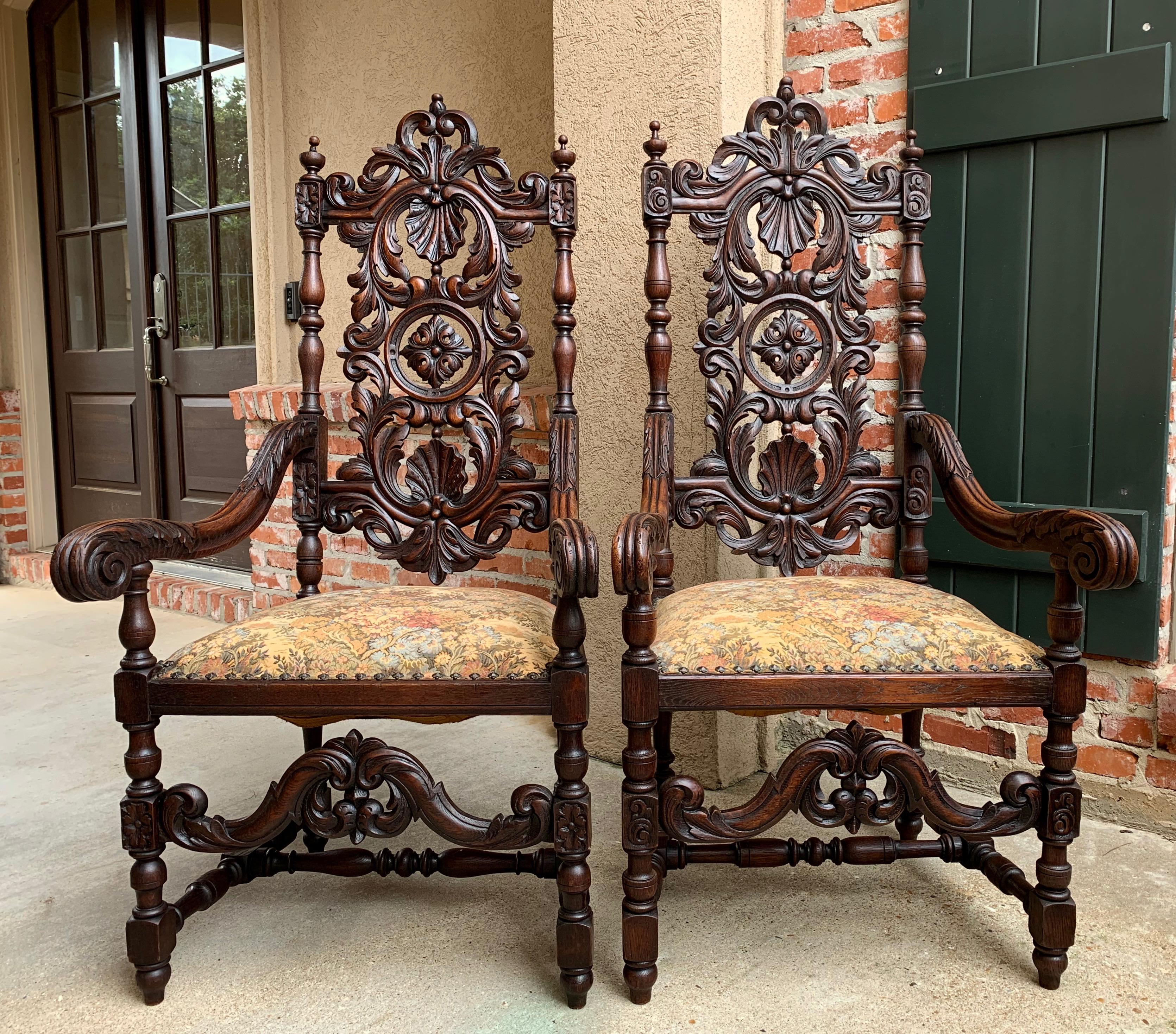 Direct from France, a pair of large antique French carved arm chairs with beautiful carved features and elegant silhouette!~
~High open carved upper rail with large open carved shell and foliate/scroll splat and thick, turned stiles!~
~The carvings