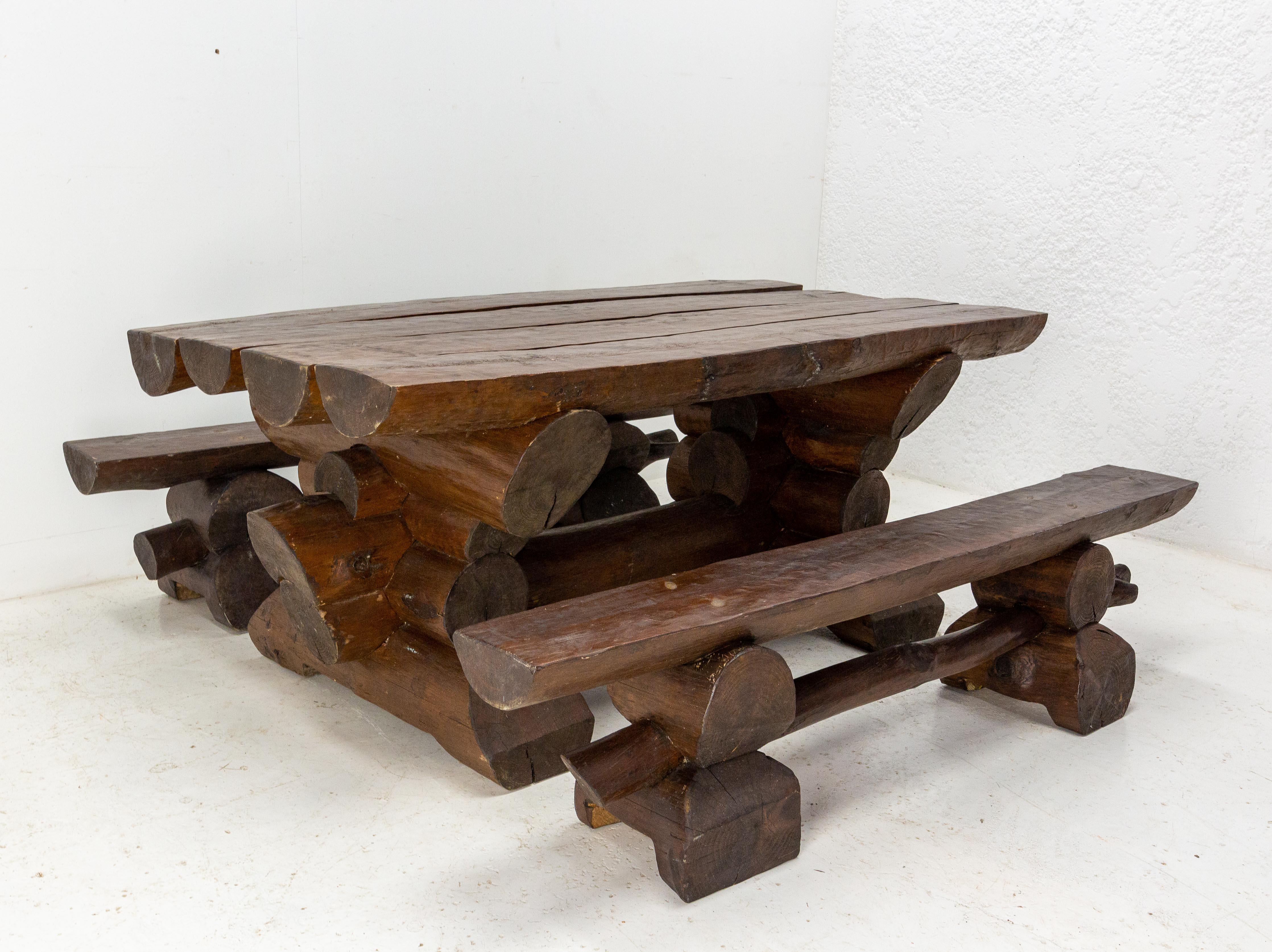 French dining table and benches.
This set was made buy a craftsman with the wood of Martin Cyclone which passed through all Europe from the 26th to the 28th of December, 1999. 
The wood comes from the forest 