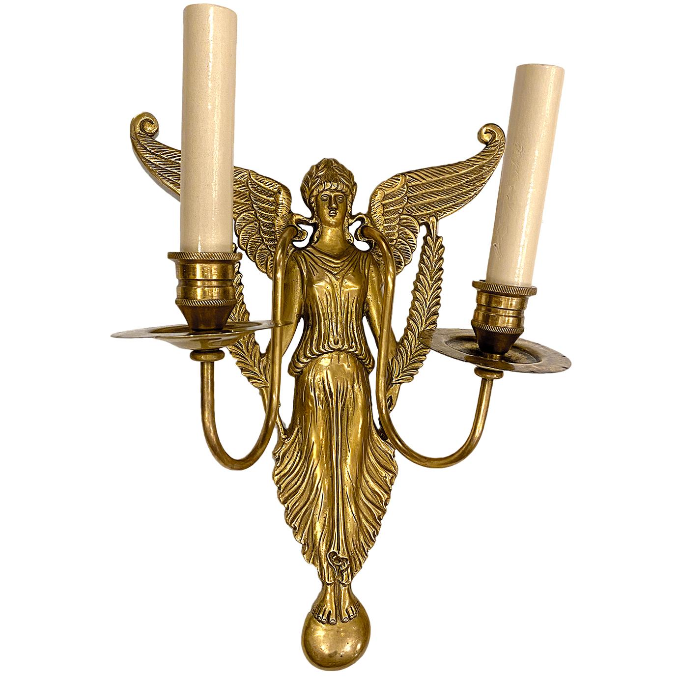 A set of eight circa 1930's gilt bronze double light Empire style sconces. Sold per pair.

Measurements:
Height 13.5