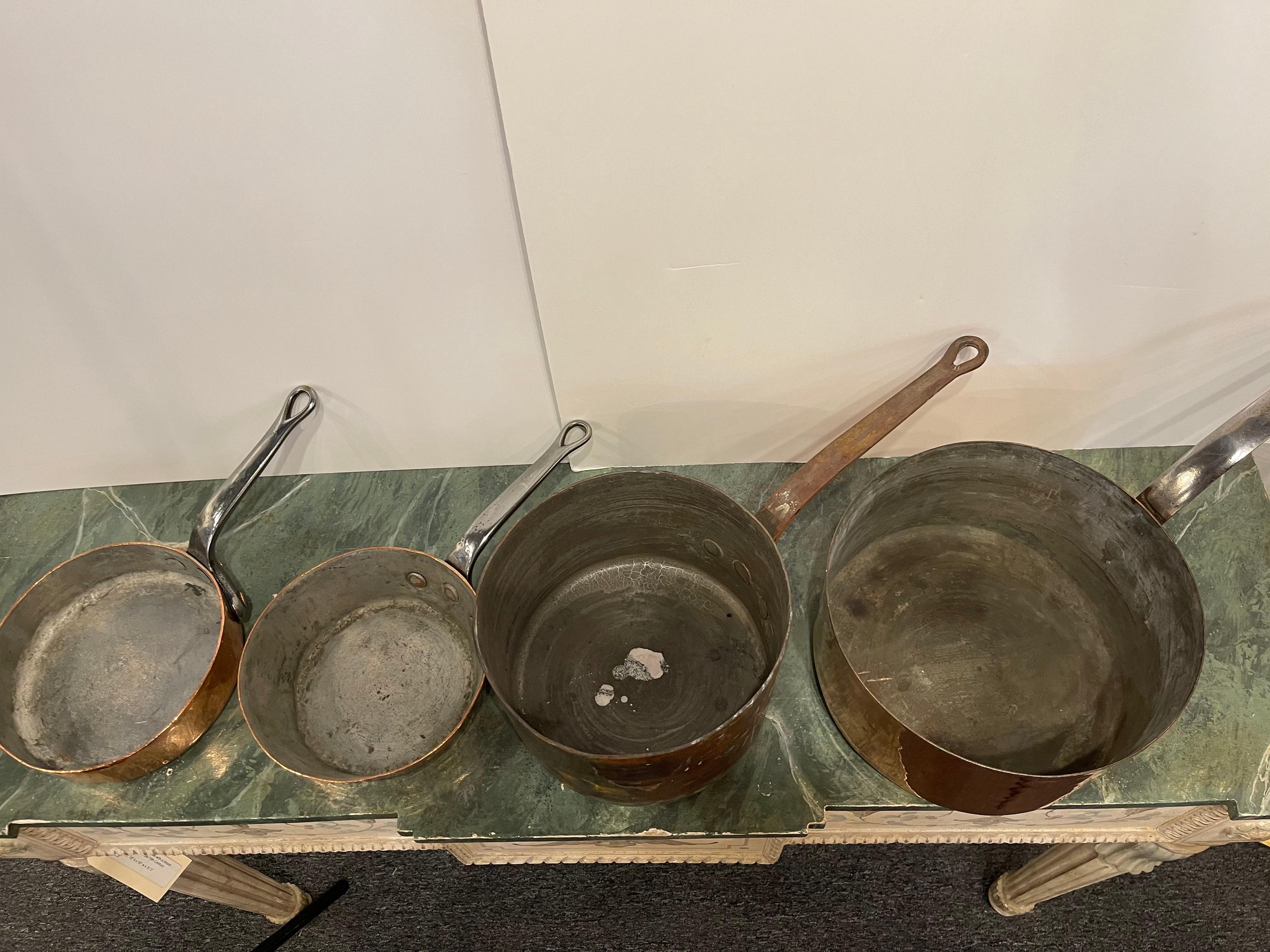 Set of French Four Copper Pots in Different Sizes, 19th Century.  Professionally cleaned and polished in France.  A light coat of copper was applied.

Diameter dimensions:  8