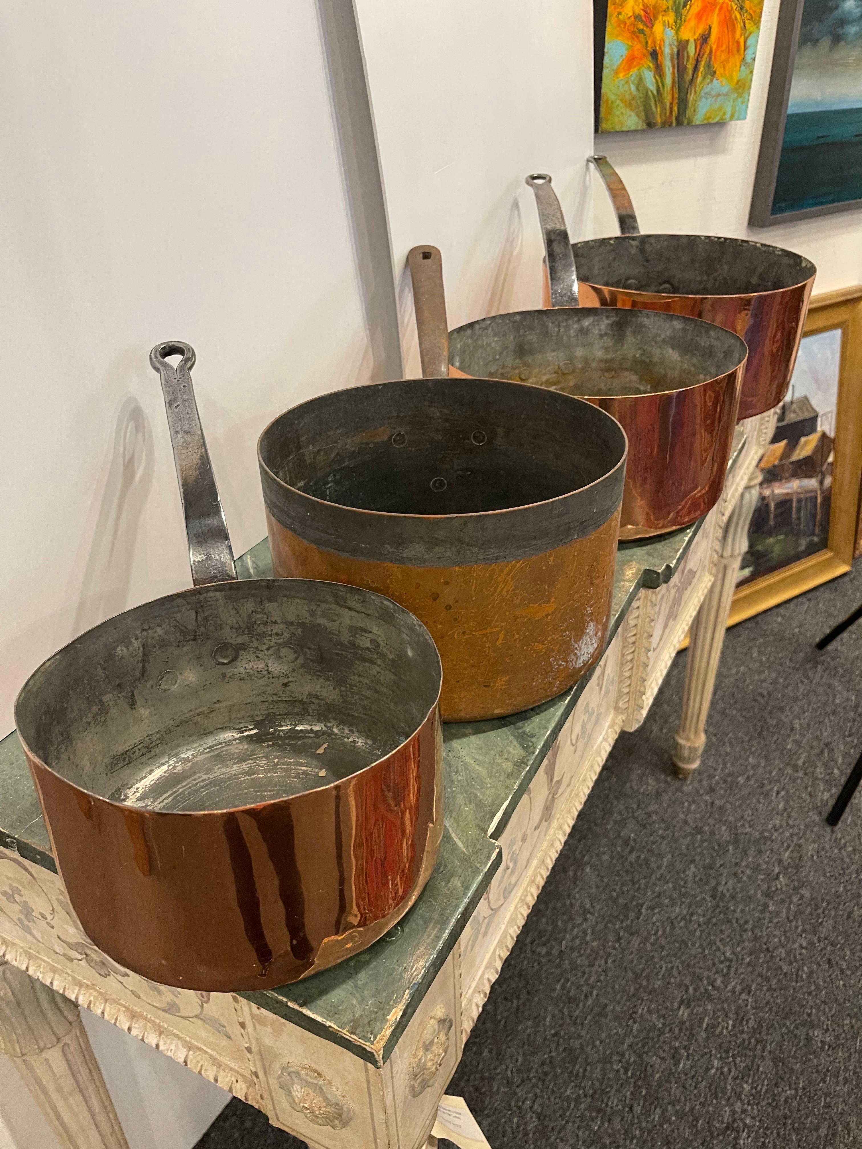 Set of French Four Copper Pots in Different Sizes, 19th Century.  Professionally cleaned and polished in France.  A light coat of lacquer was applied.

Diameter Dimensions:
8.5
