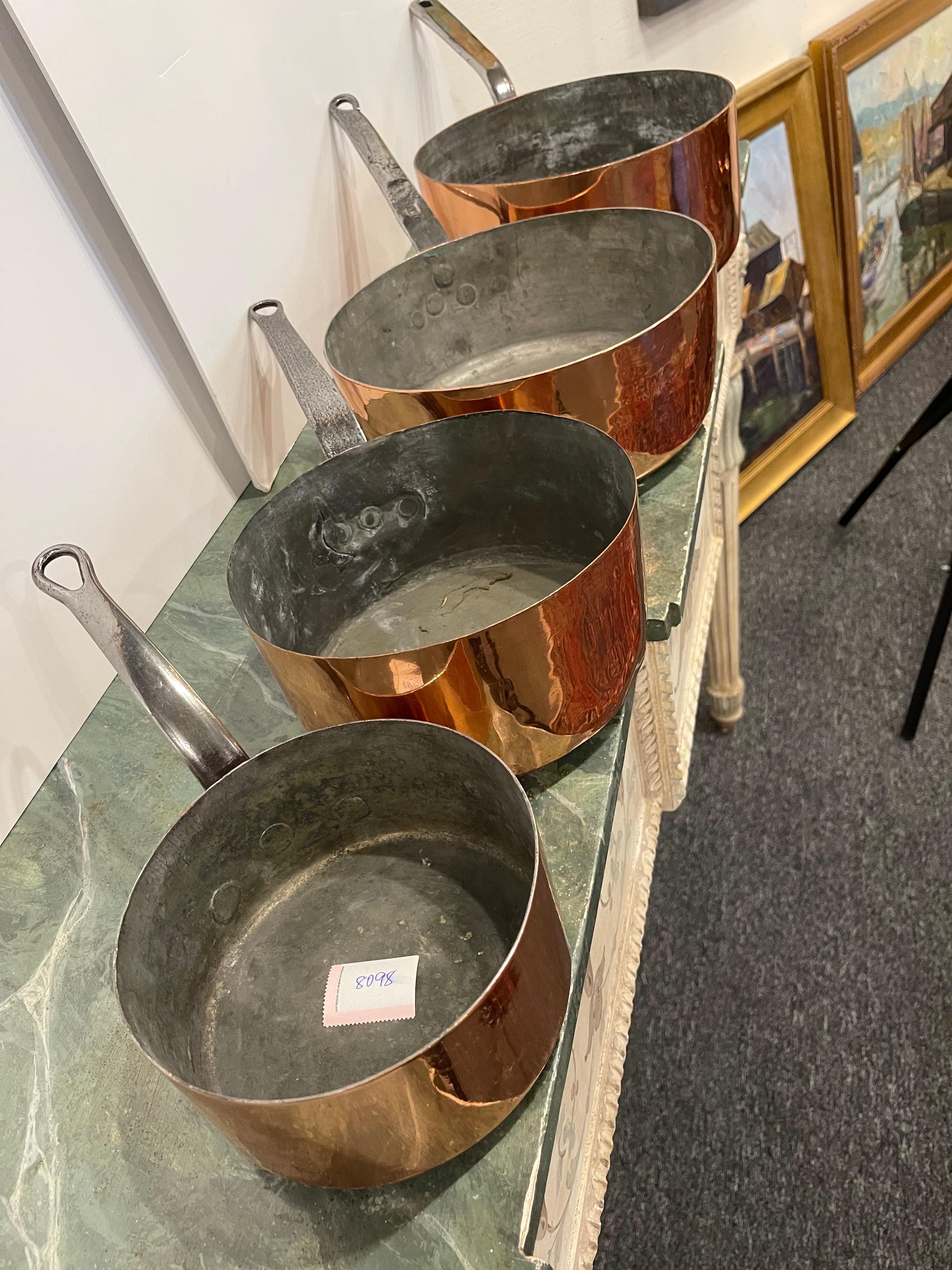Set of French Four Copper Pots in Different Sizes, 19th Century.  Professionally cleaned and polished in France.  A light coat of copper was applied.

Diameter dimensions:  6.75
