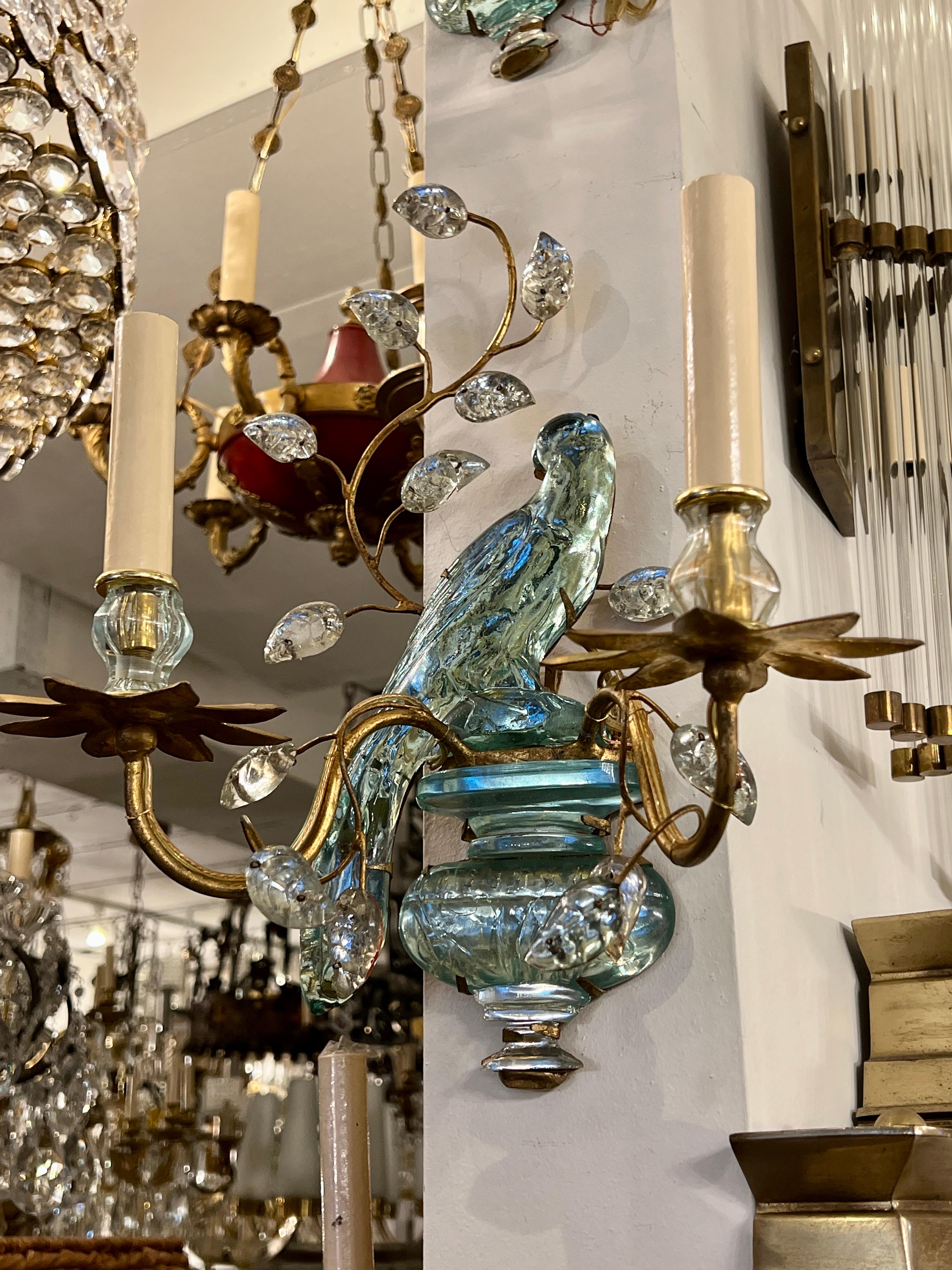 A set of four of circa 1950's French gilt metal two-arm sconces with molded glass parrot and leaves. Sold per pair.

Measurements:
Height 14