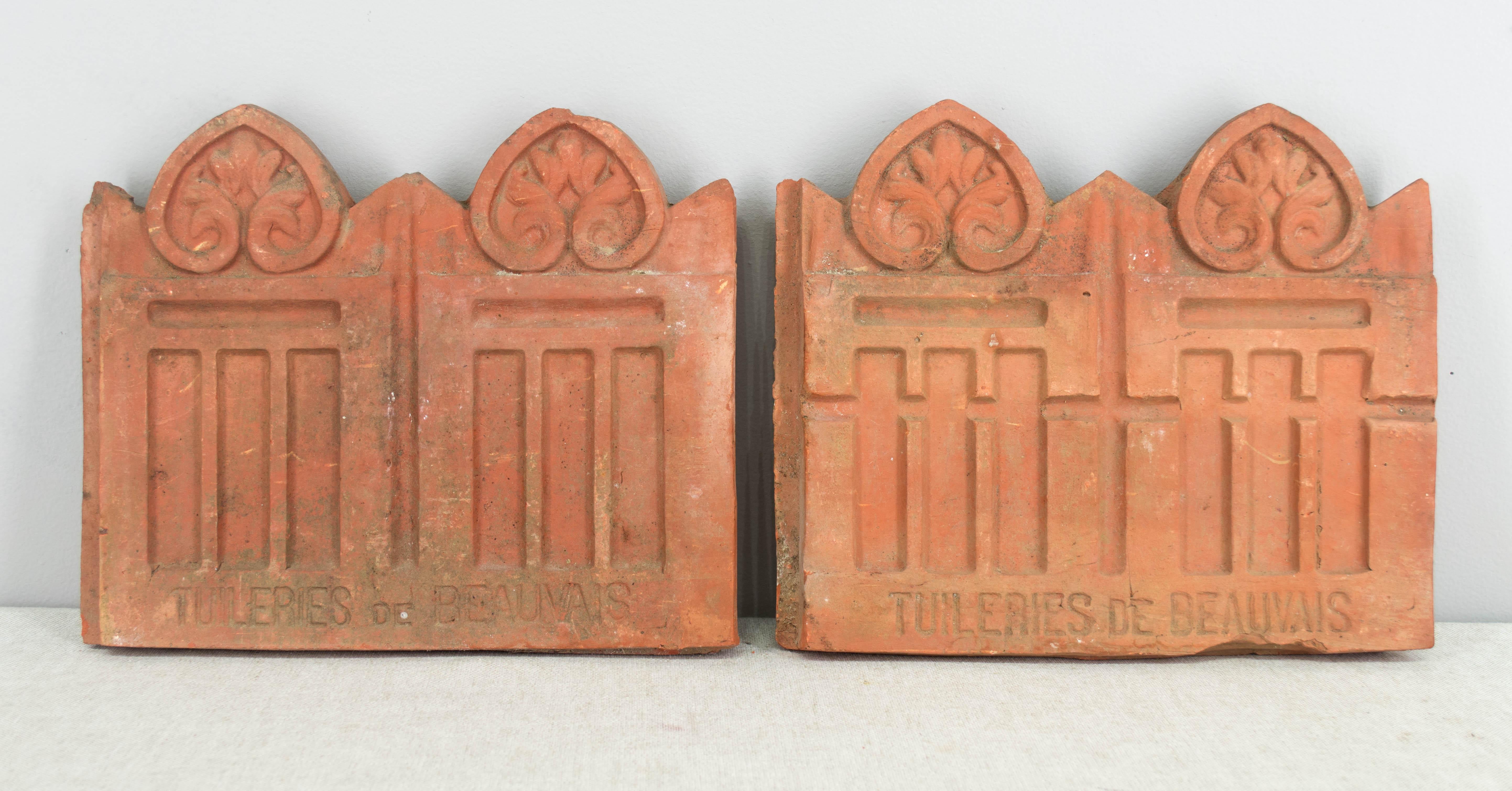 Set of 25 French terracotta garden tiles. For use as border decoration, these tiles are double sided and have an overlapping edge so they fit closely together. Nice old patina, each vary in condition with some having chips. Stamped: Tuileries de