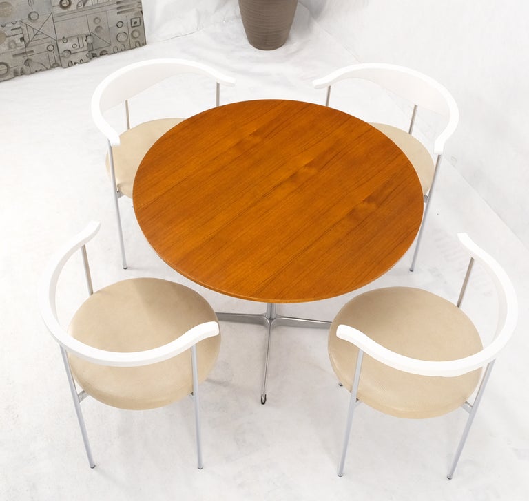 Fritz Hansen set of round teak & chrome dining game table & 4 barrel back white lacquer arm chairs.

Table is 36
