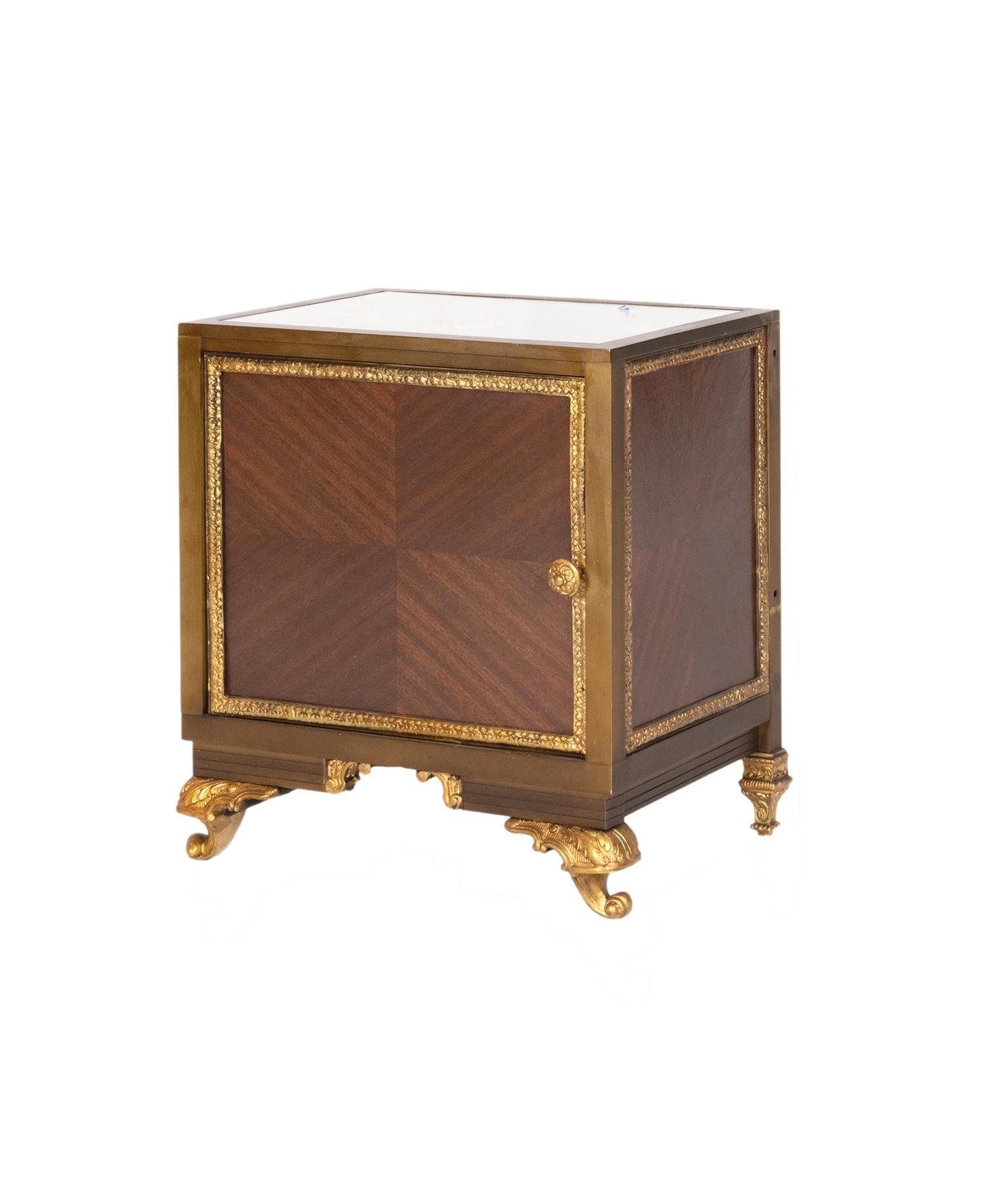 A set of three nightstand bedside tables:

A bedside nightstand table with three drawers, gilded bronze and parquetry in a twist between mid century and Louis XV style.

A bedside table with mirrored top with encrusted stars, gilded bronze and