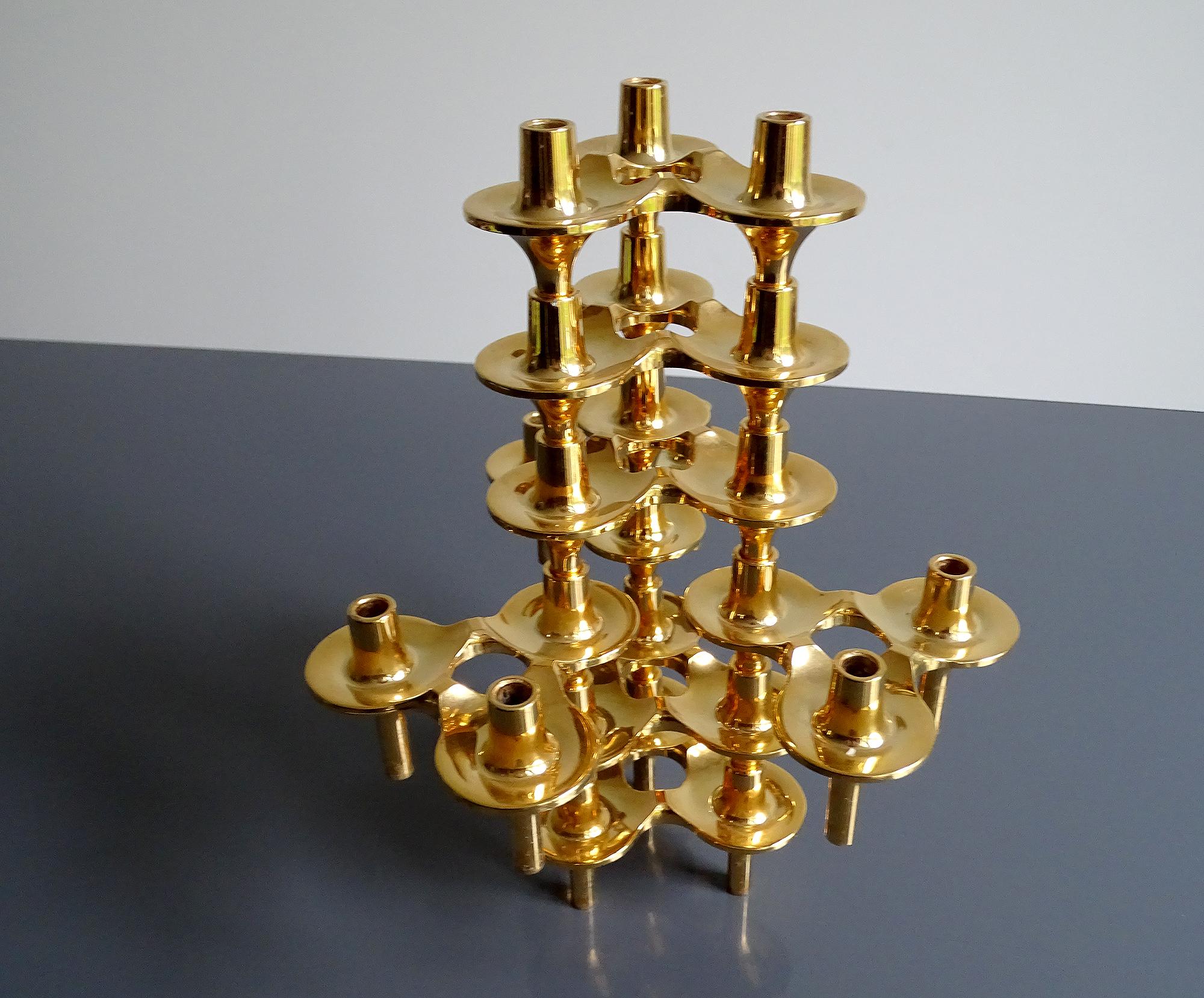 Set of 8 modular stackable candlesticks designed by Ceasar Stoffi and manufactured by BMF (Bavarian Metal Manufacturer) circa 1965-1970. The set was designed to allow for unlimited combinations or be used individually. The gilded versions are much