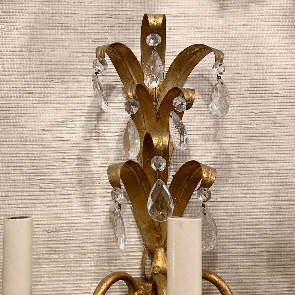A set of six circa 1940's Italian gilt metal and faceted crystal drop sconces. Sold in pairs.

Measurements:
Height: 17?
Width: 13?
Depth: 8?